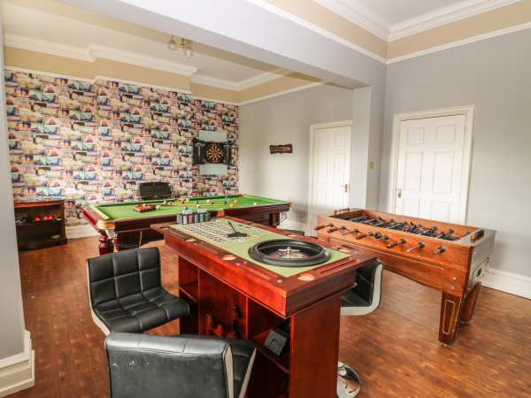 Versatile recreational space in Peak Manor with pool table for team-building events.