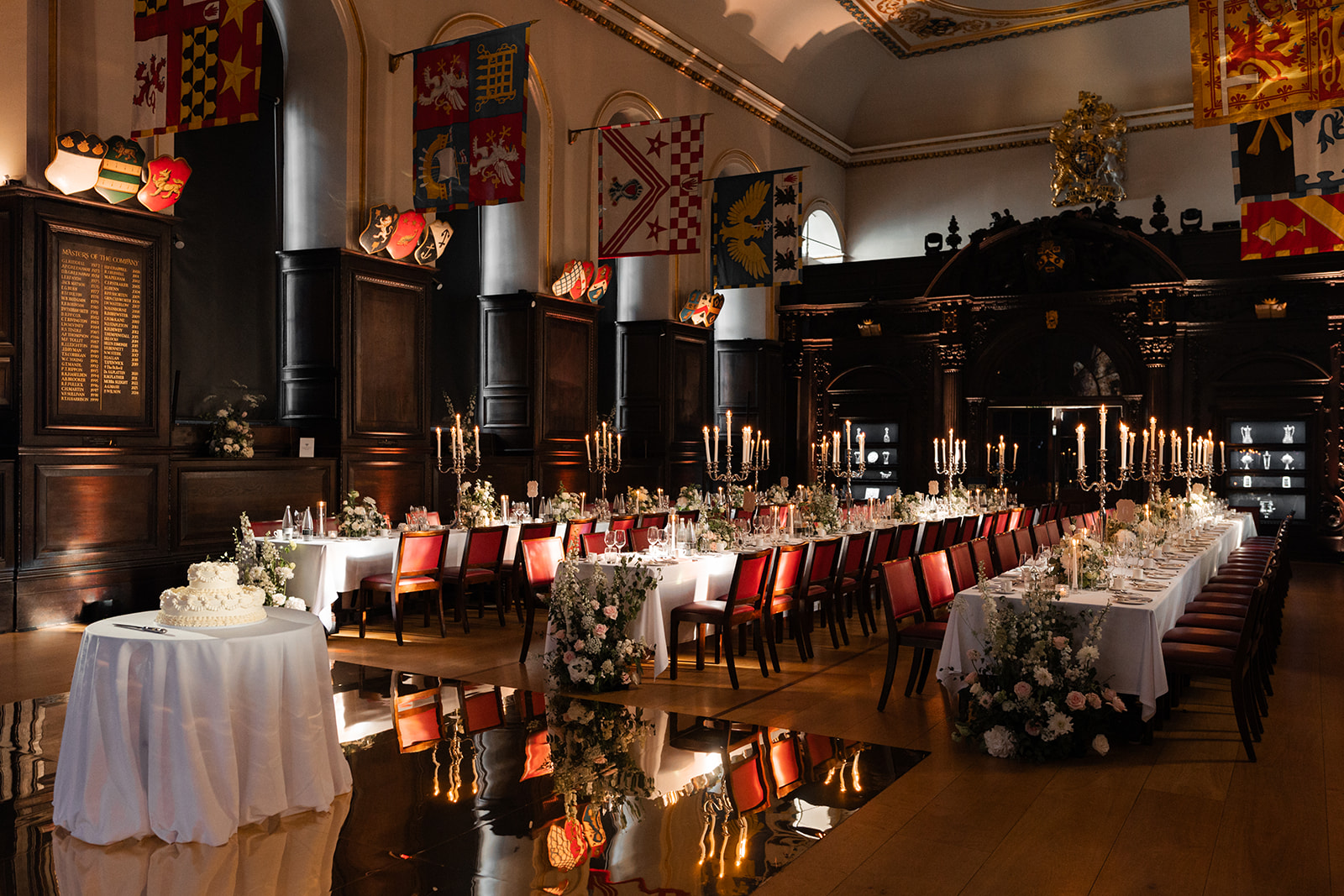 Elegant wedding banquet at Stationers' Hall with floral centerpieces and candelabras.