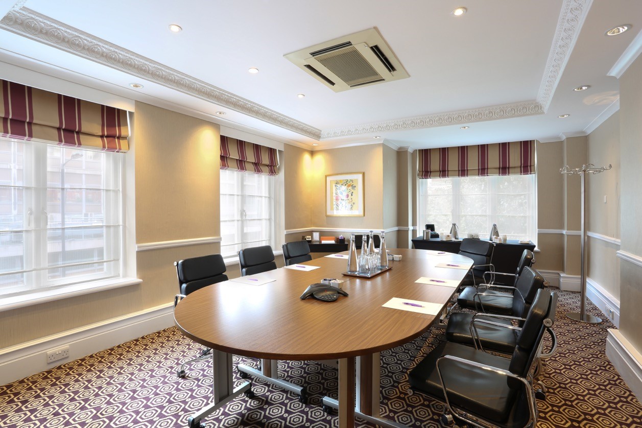 Trafalgar Suite at St Ermin’s Hotel, oval table, ideal for meetings and presentations.