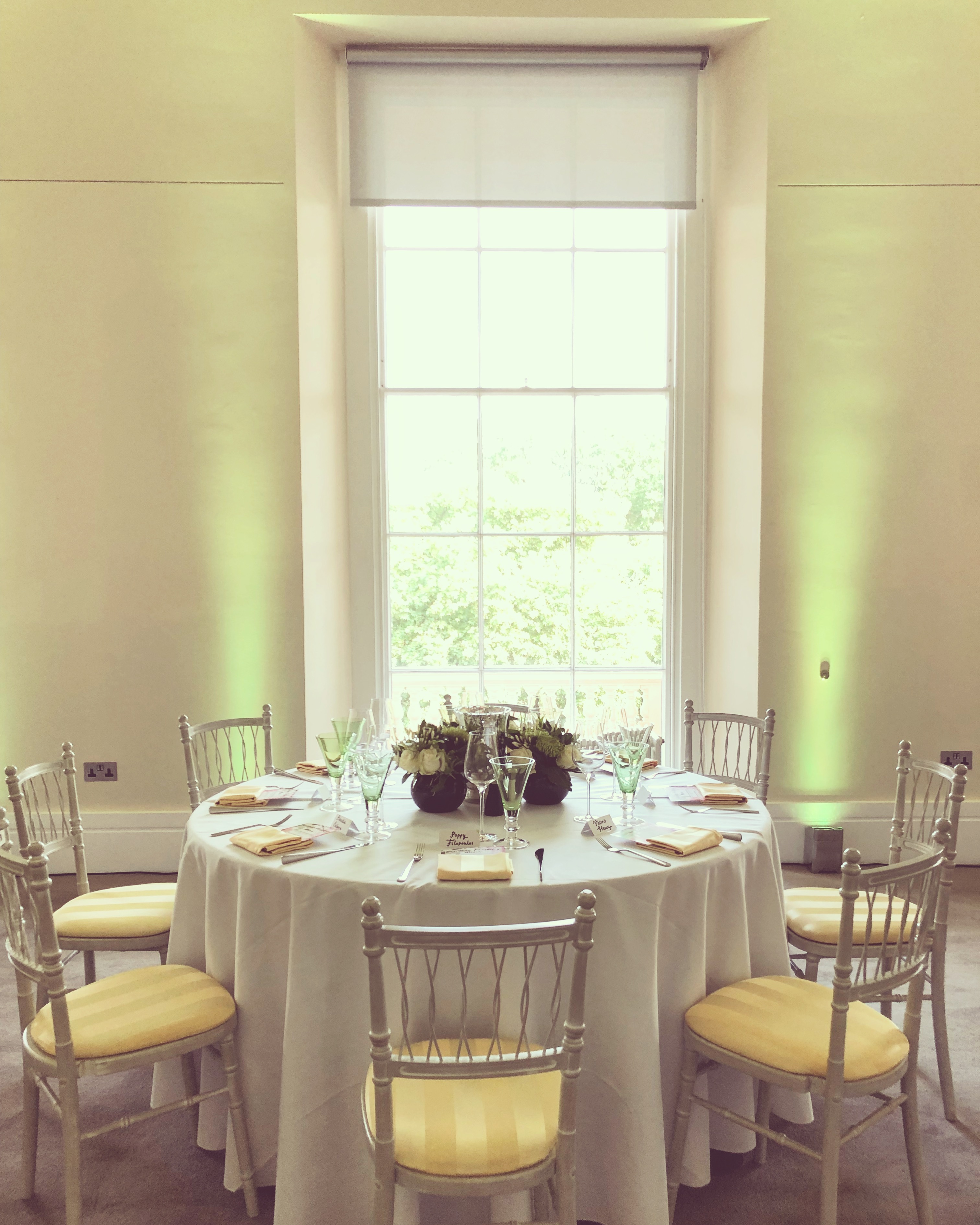 Elegant wedding table setting with floral centerpiece at Prince Philip House.