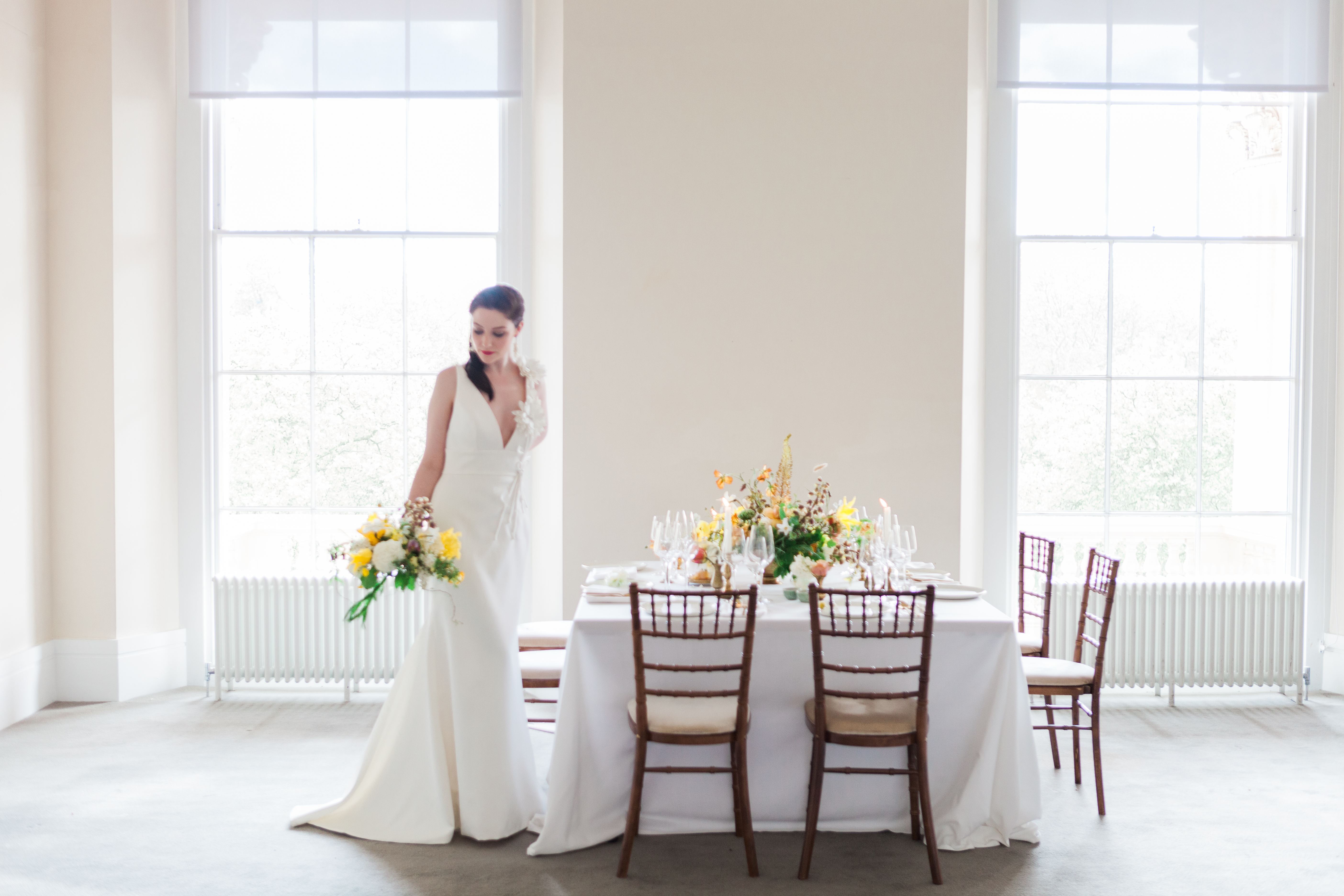 Elegant wedding table at Prince Philip House with bride in stunning gown and floral decor.