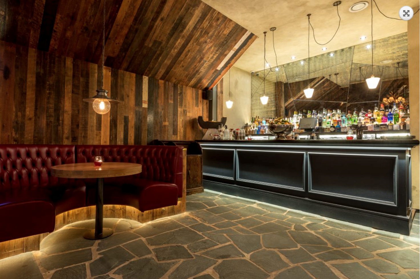 Stylish bar with cozy seating, ideal for networking events and cocktail receptions.