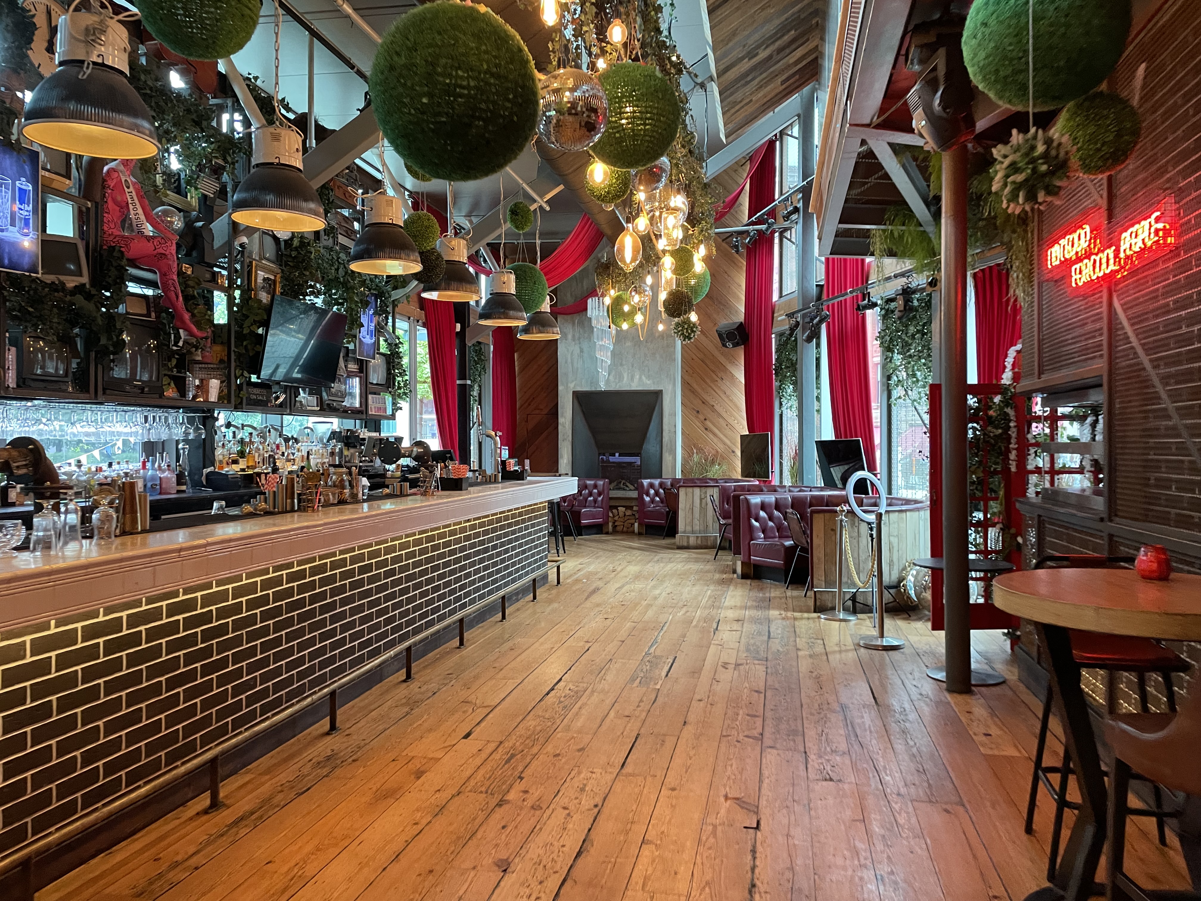 Vibrant event space at Impossible Bar with modern decor, ideal for gatherings and networking.