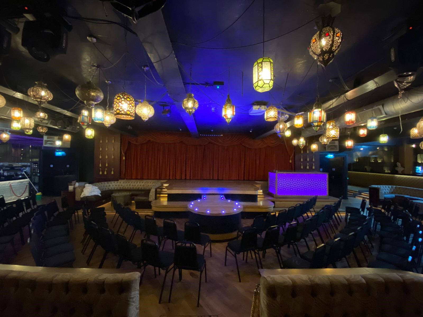 Impossible Theatre event space with intimate seating, perfect for corporate and social gatherings.