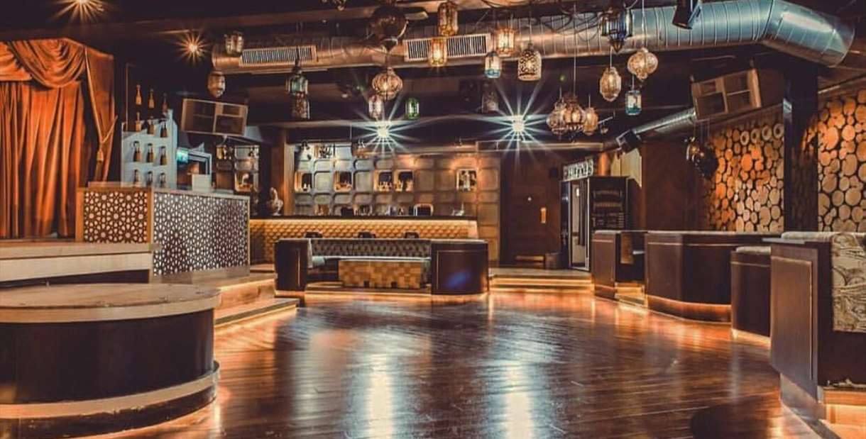 Stylish event space at Impossible Theatre with warm lighting for networking and receptions.