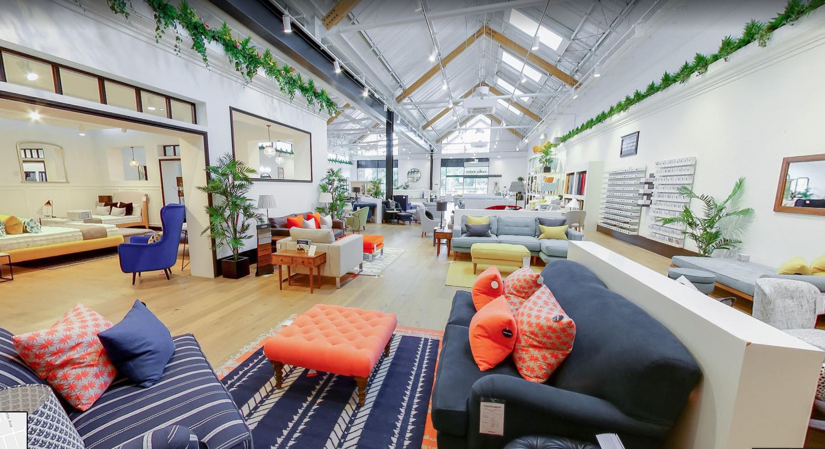 Spacious Sofa.com Harrogate showroom with vibrant decor for networking events.