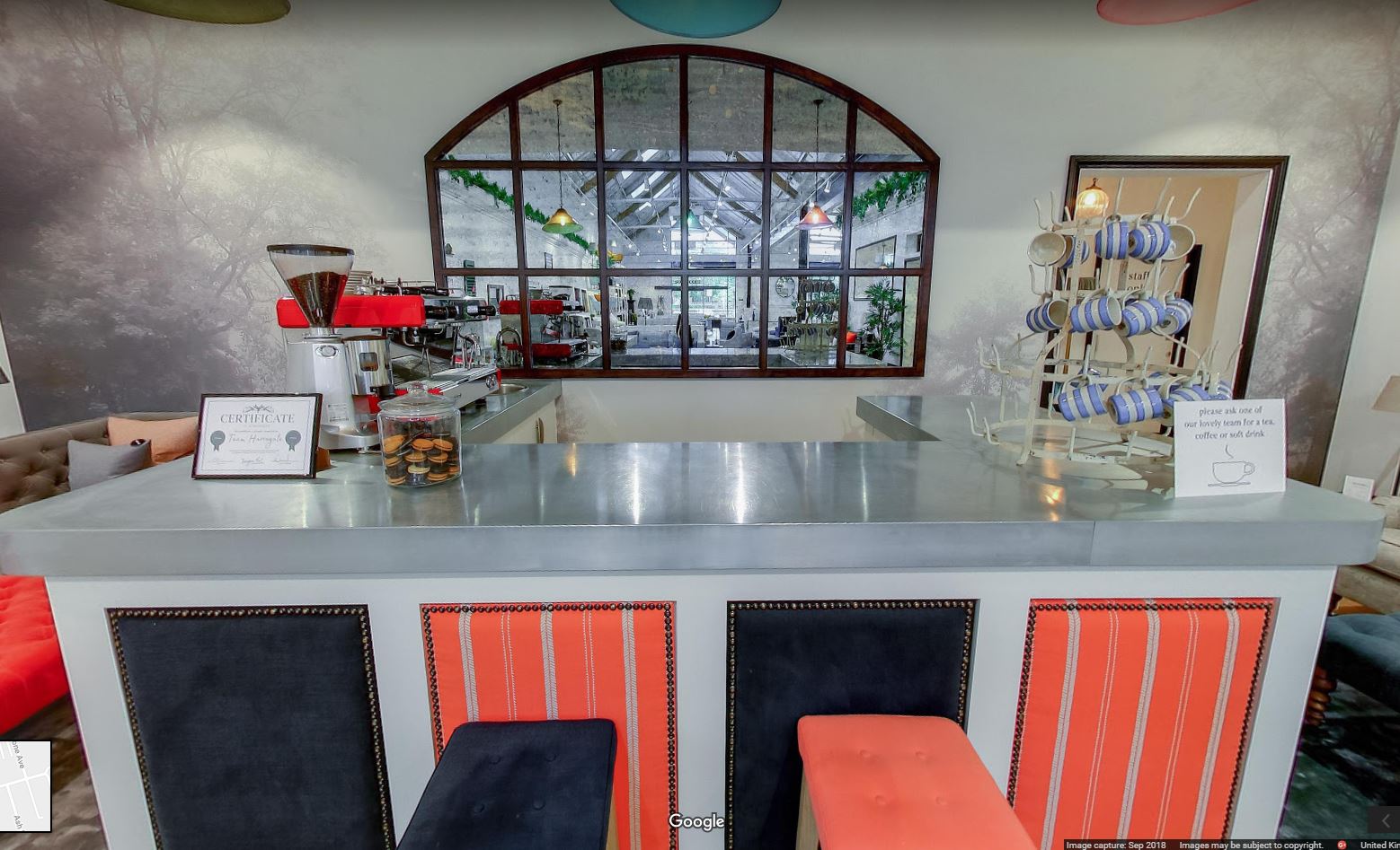 Stylish event space at Sofa.com Harrogate with modern seating and bar for corporate gatherings.