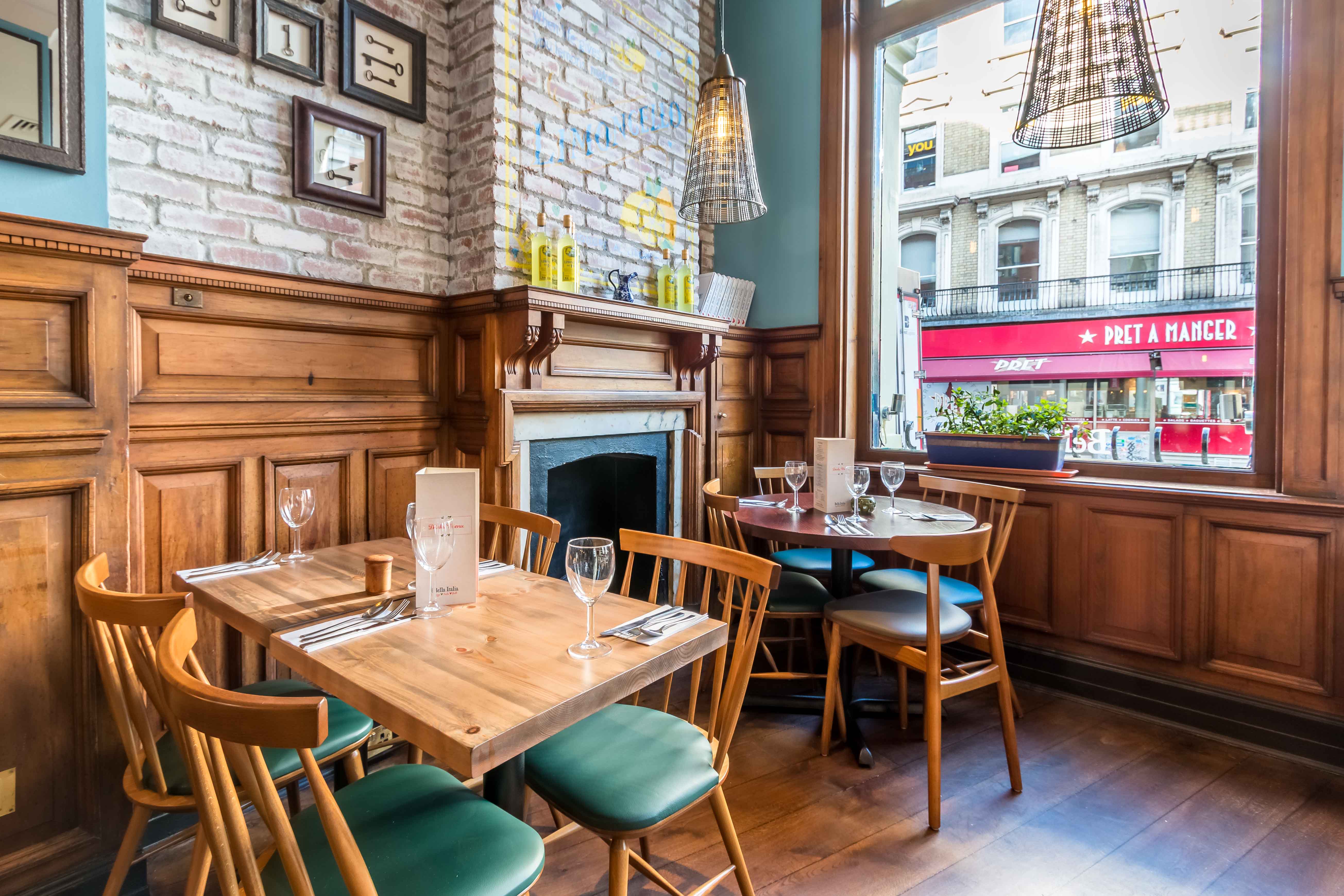 Cozy dining area with wooden accents at Bella Italia, ideal for networking lunches and small events.
