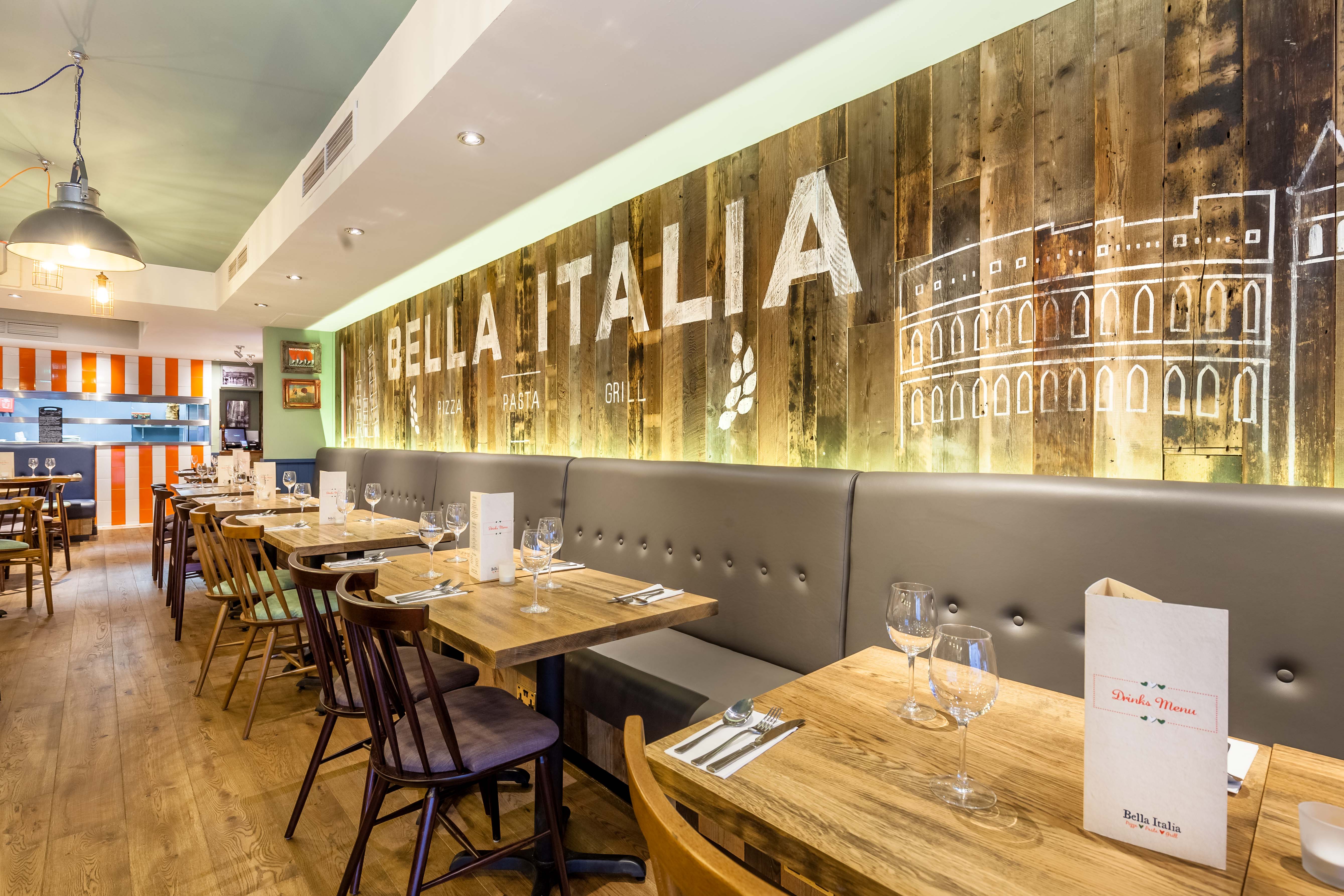 Vibrant Bella Italia venue with rustic decor, ideal for casual meetings and events.