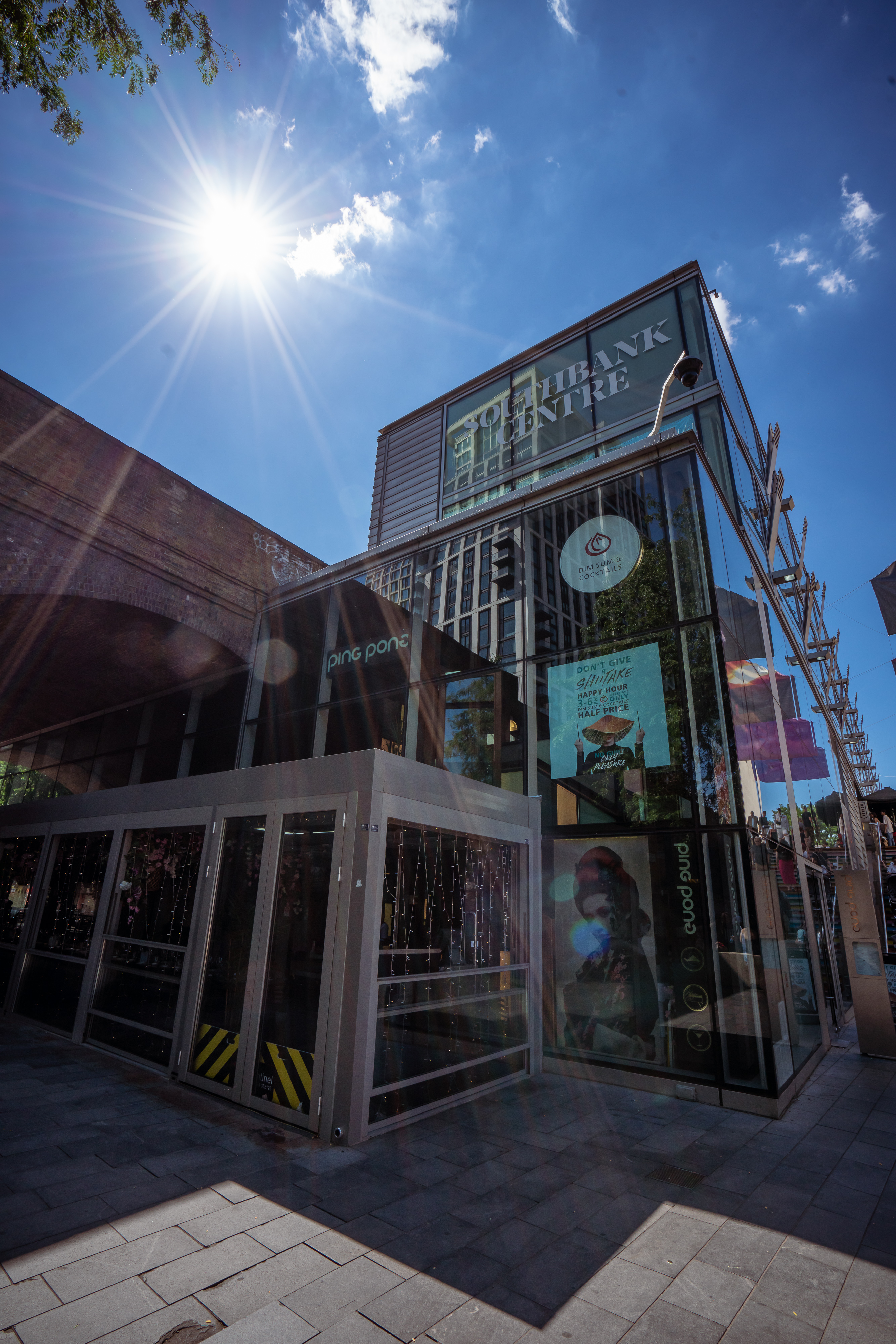 Cherry Blossom Private Terrace, modern venue with glass facade for events and gatherings.