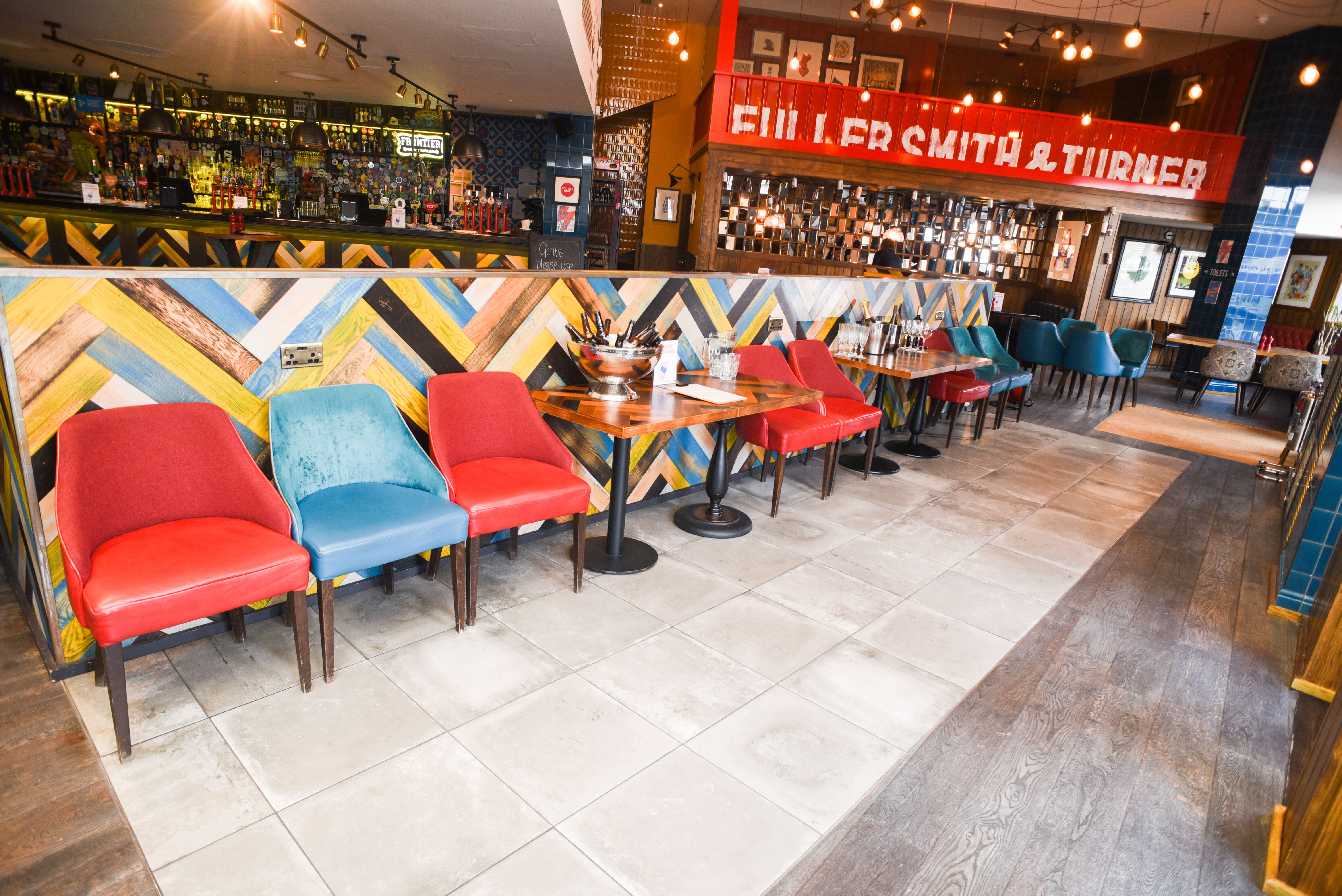 Vibrant venue with colorful seating for casual meetings and networking events.