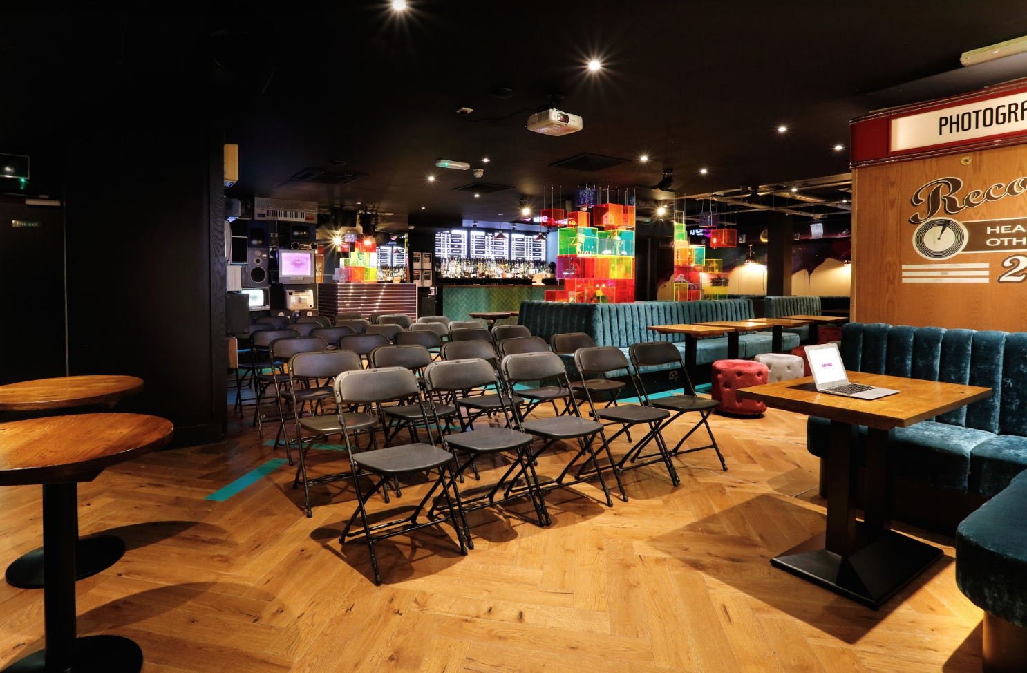 Bar area in Lucky Voice Holborn, vibrant decor for meetings and events.