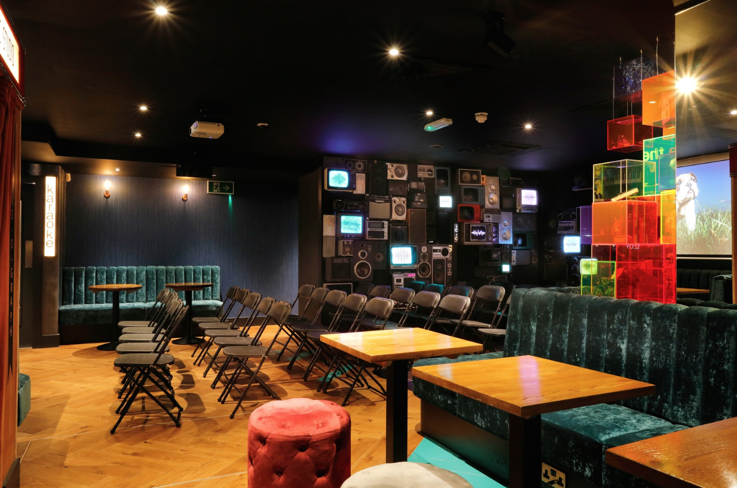 Bar area in Lucky Voice Holborn, vibrant decor for workshops and social gatherings.
