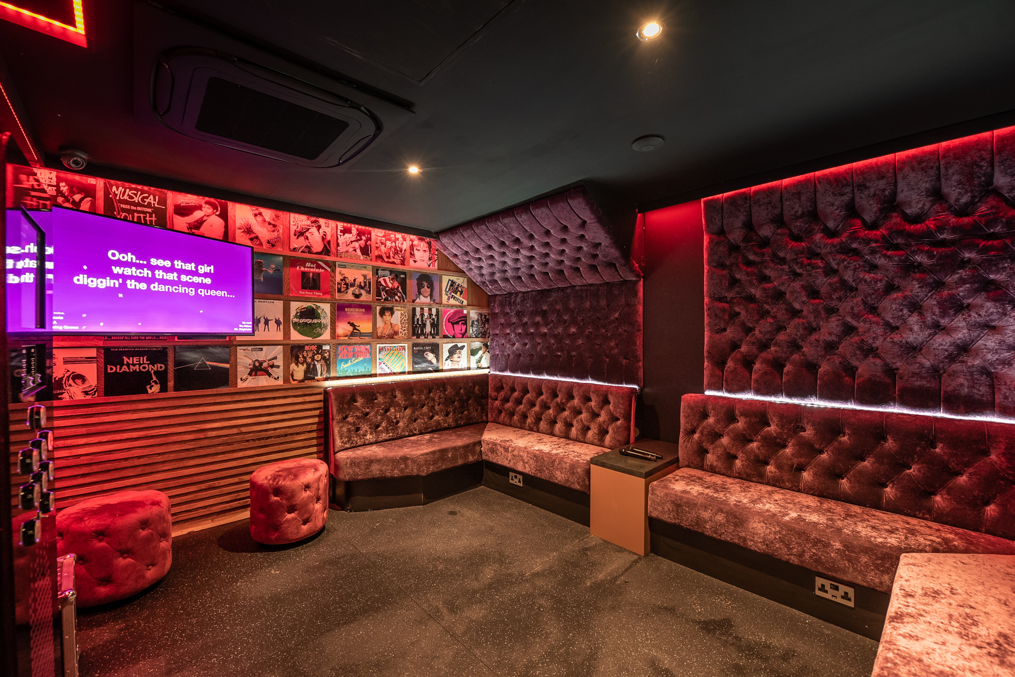 Stylish bar area with plush seating for intimate gatherings at Lucky Voice Holborn.