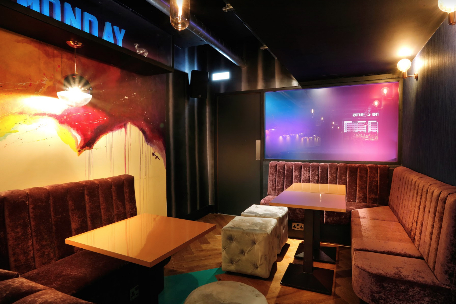 Private karaoke room at Lucky Voice Holborn with vibrant decor for events and gatherings.