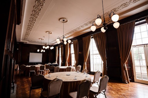 Elegant meeting space in Manchester Hall with natural light, perfect for presentations and discussions.