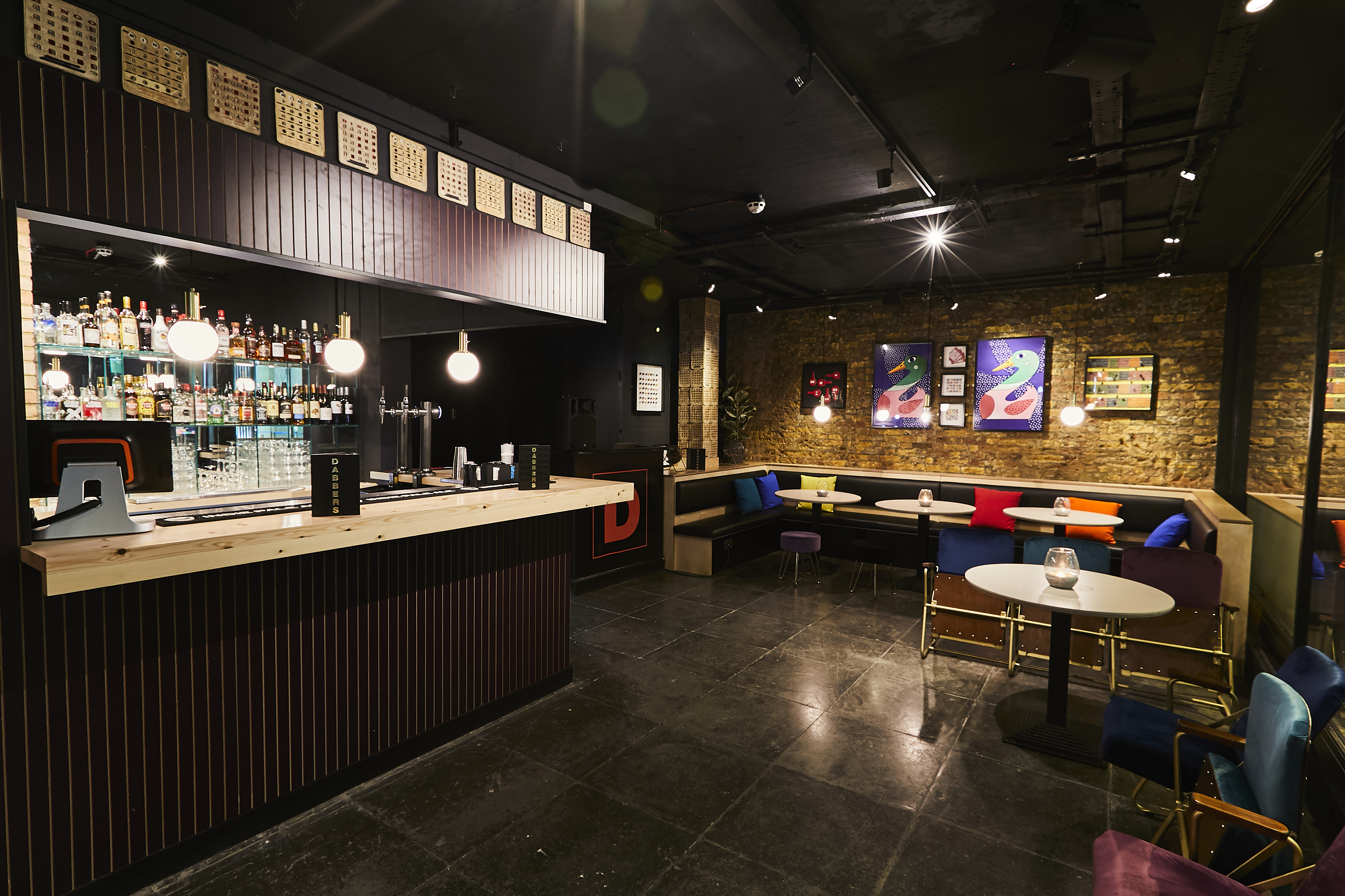 Modern venue with cozy seating for social events at Dabbers Social Bingo.