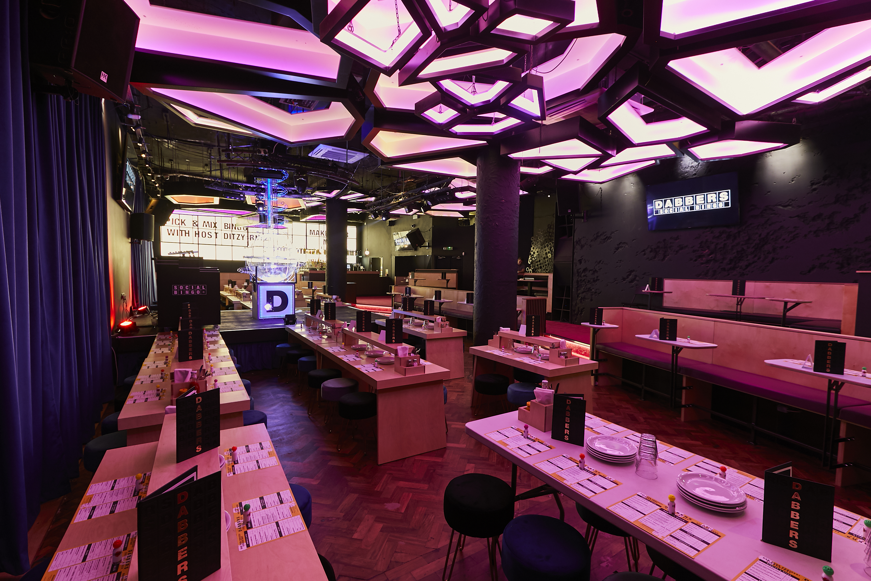 Modern event venue with unique ceiling design, perfect for gatherings and meetings.