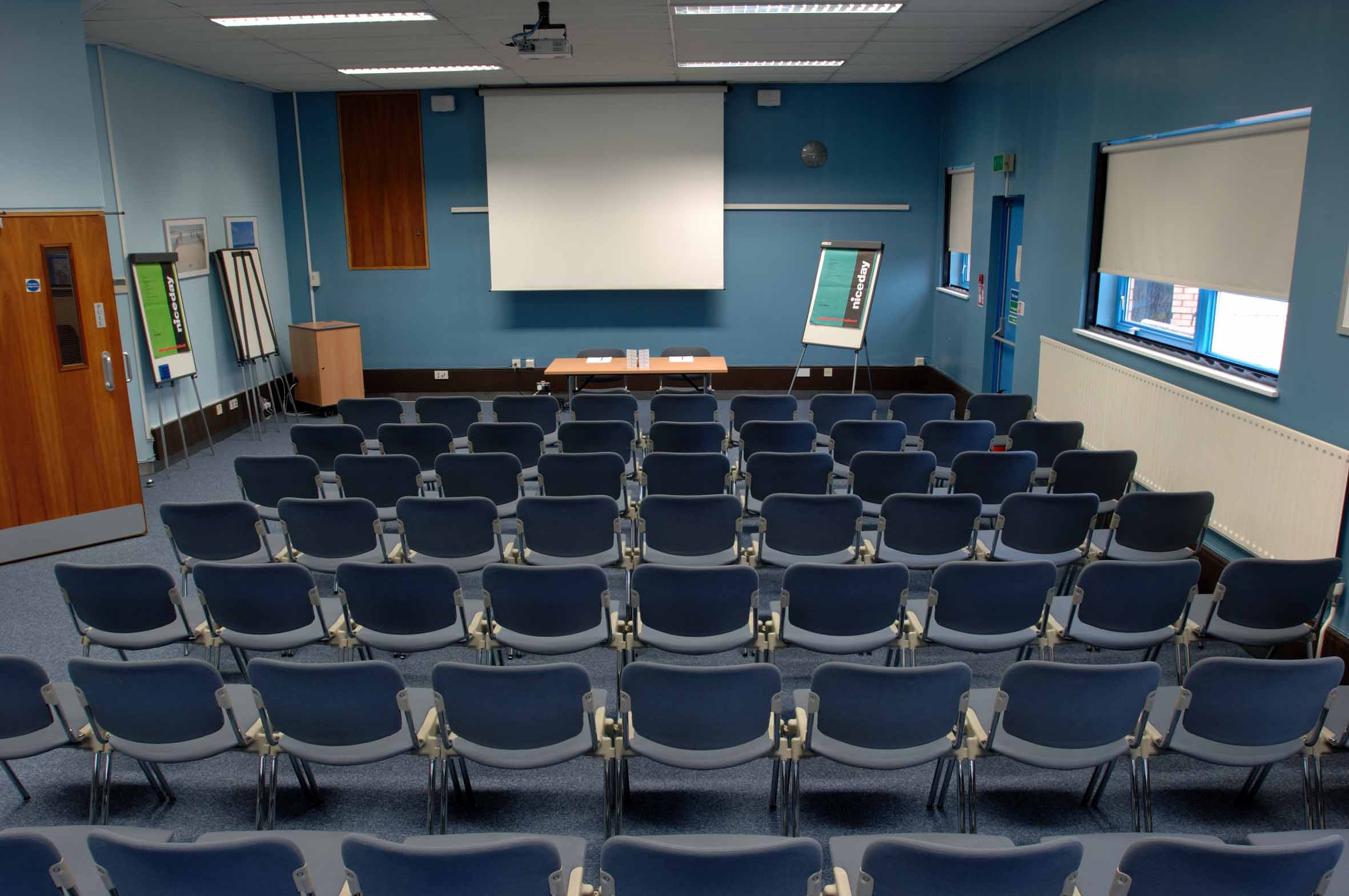 Meeting room with blue chairs, ideal for workshops and seminars in Fielder Centre.