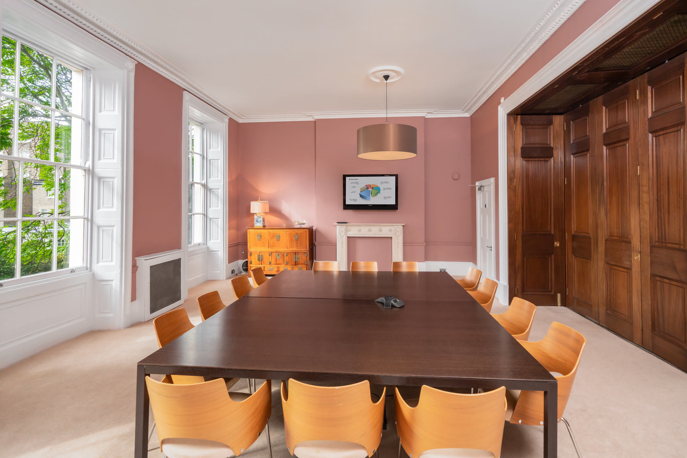 Russell Square Meeting Room with large table, ideal for meetings and presentations.
