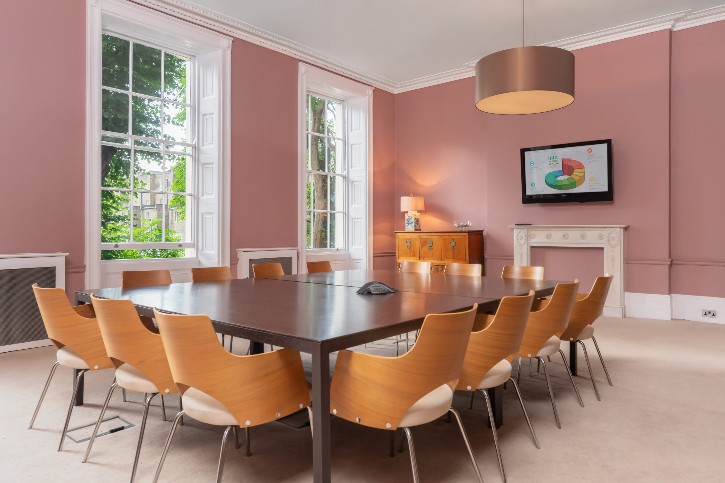 Private Gardens View Room with large table, ideal for meetings and brainstorming sessions.