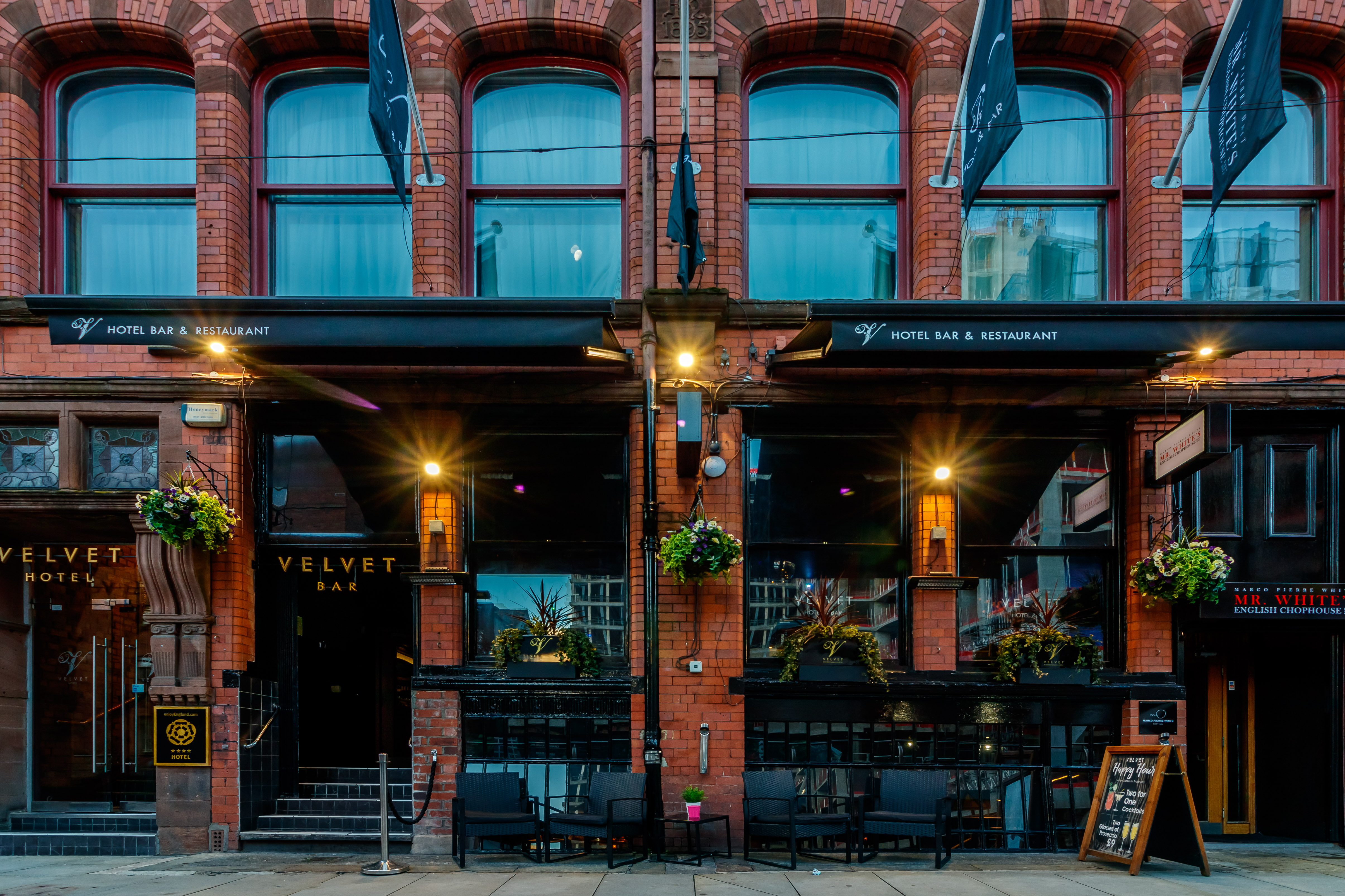 Stylish Velvet Bar with outdoor seating, perfect for events and gatherings.