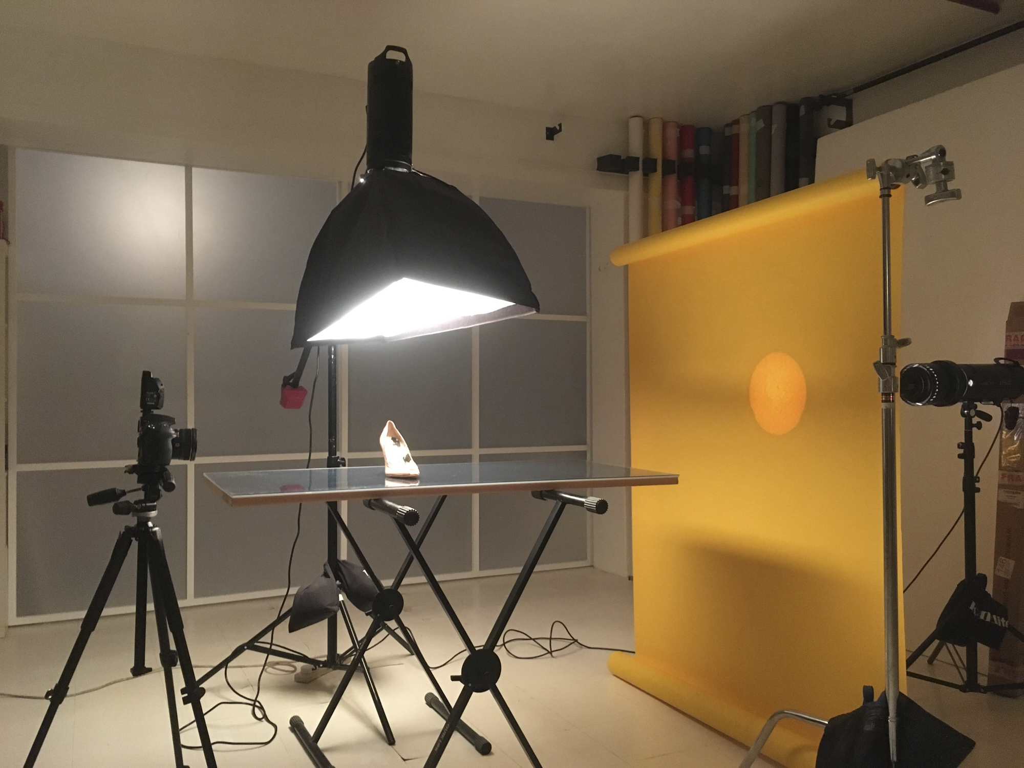 Well-equipped photography studio with bright lighting for product showcases and events.