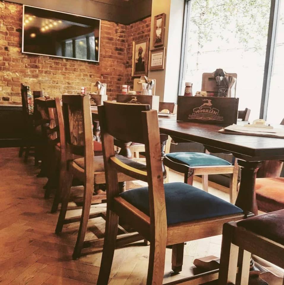 Cozy rustic dining space at Millbank Corner, ideal for gatherings and meetings.