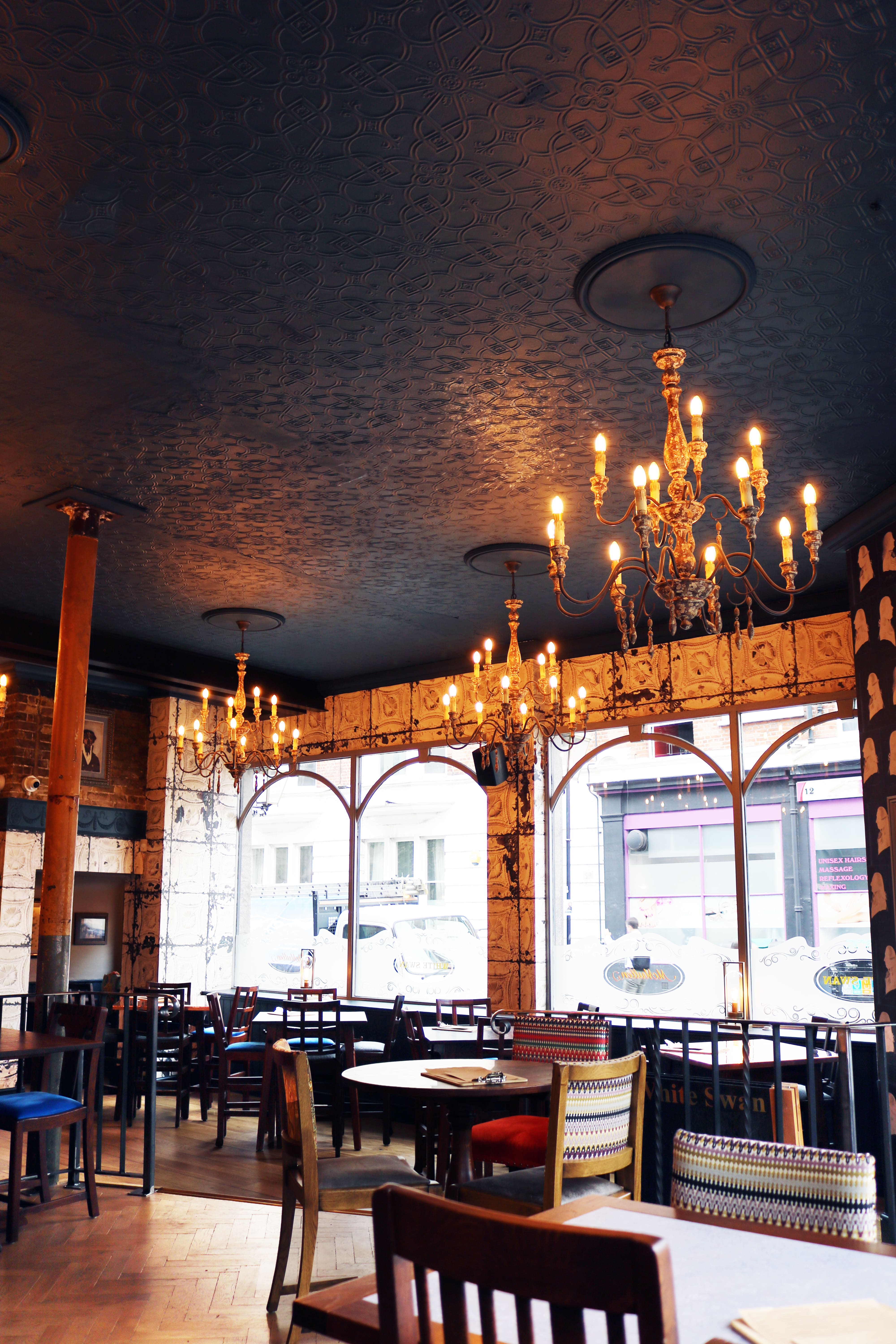 Elegant Pimlico Corner venue with chandeliers, perfect for networking events and gatherings.