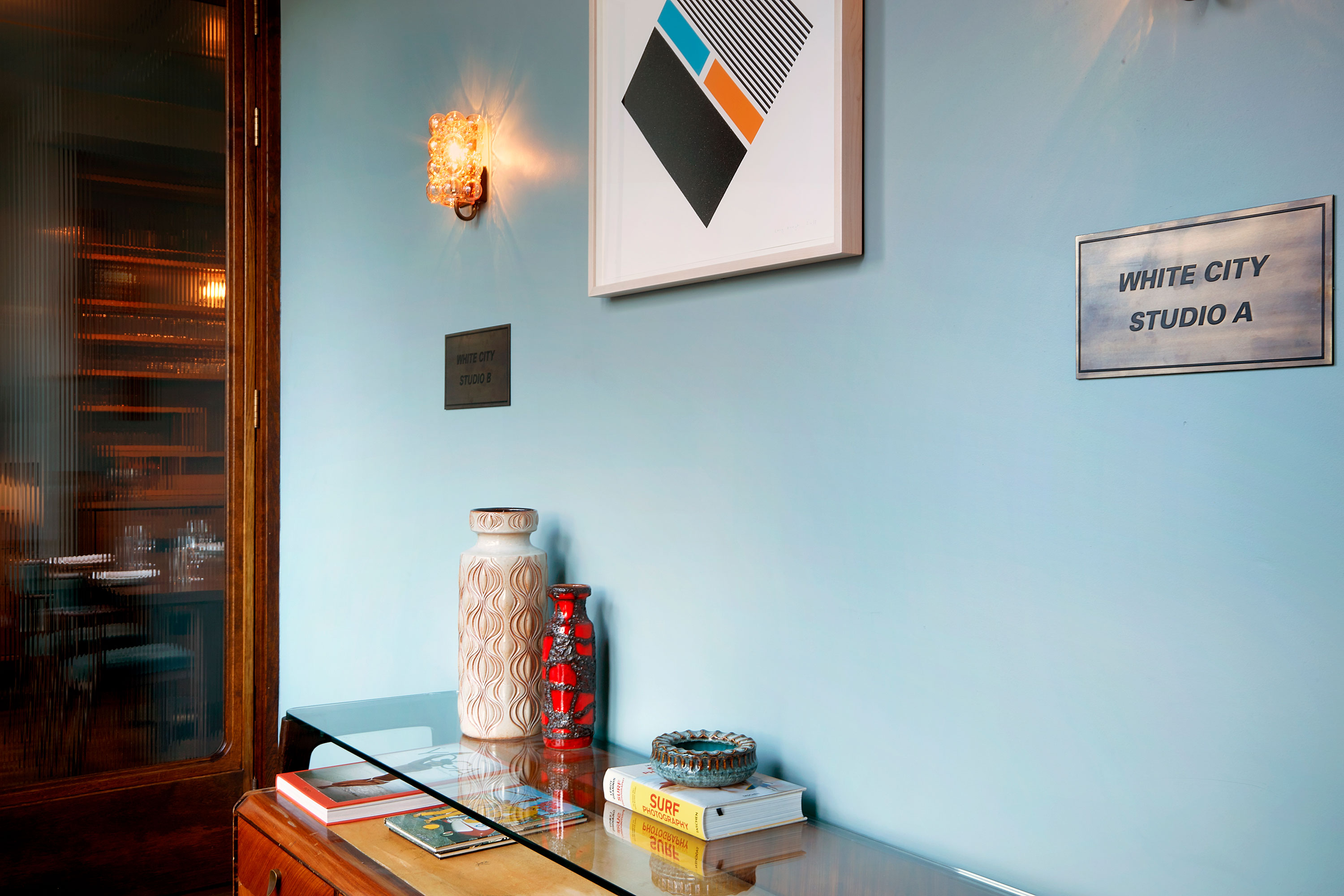 White City Studio meeting space with calming blue wall, ideal for creative events.