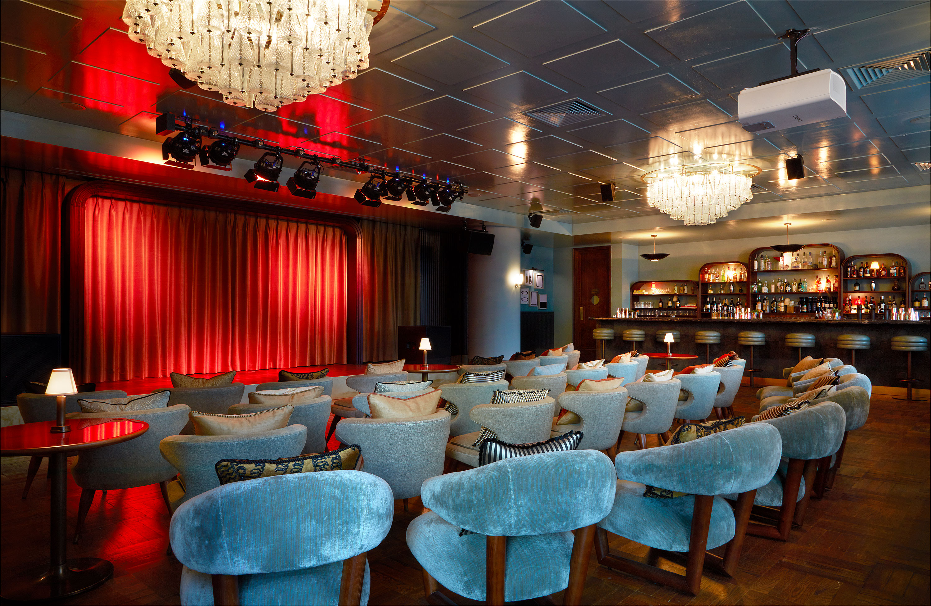 Stylish event space with plush seating for presentations and performances in White City Studio.