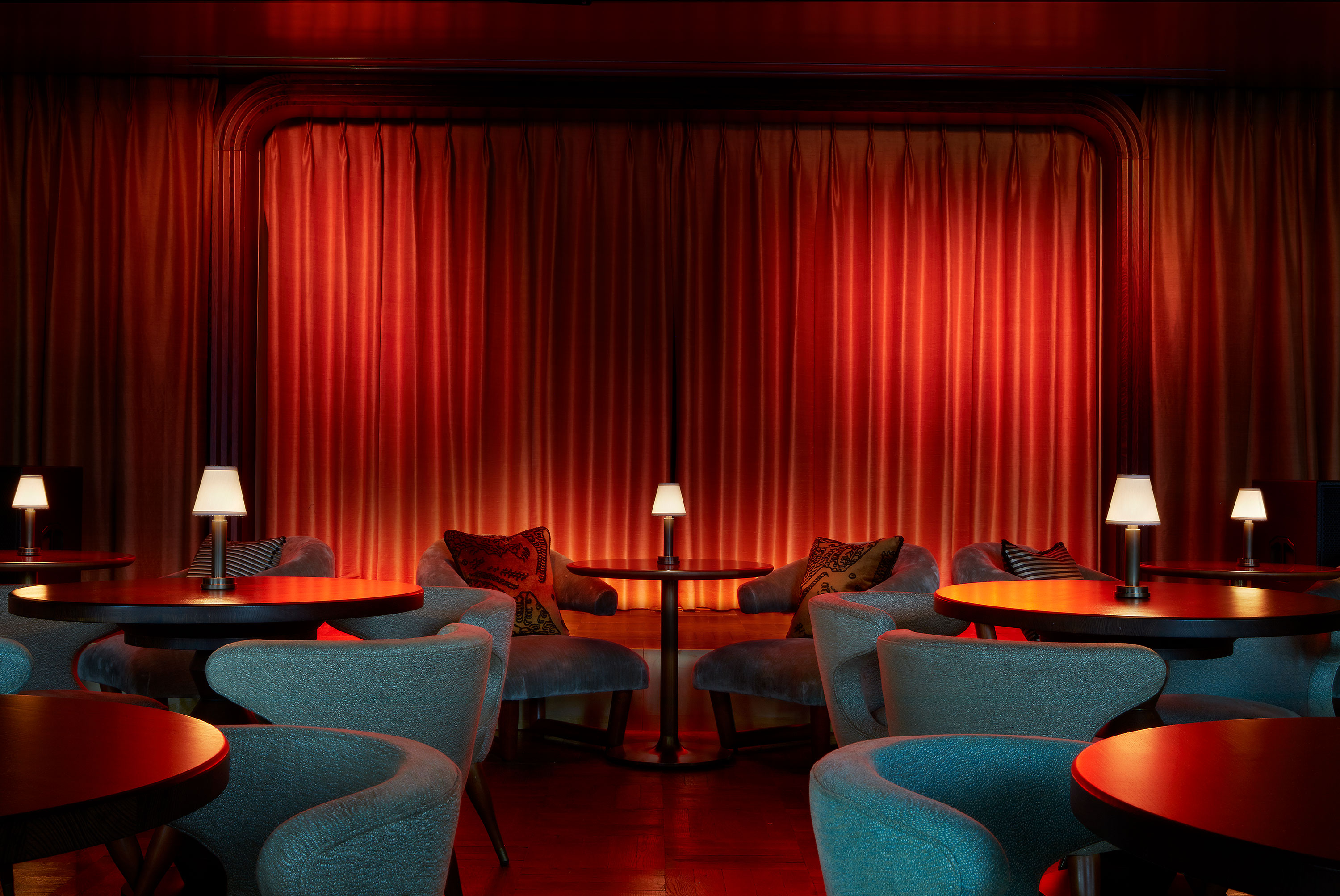 Elegant event space with warm lighting, ideal for networking and cocktail receptions.