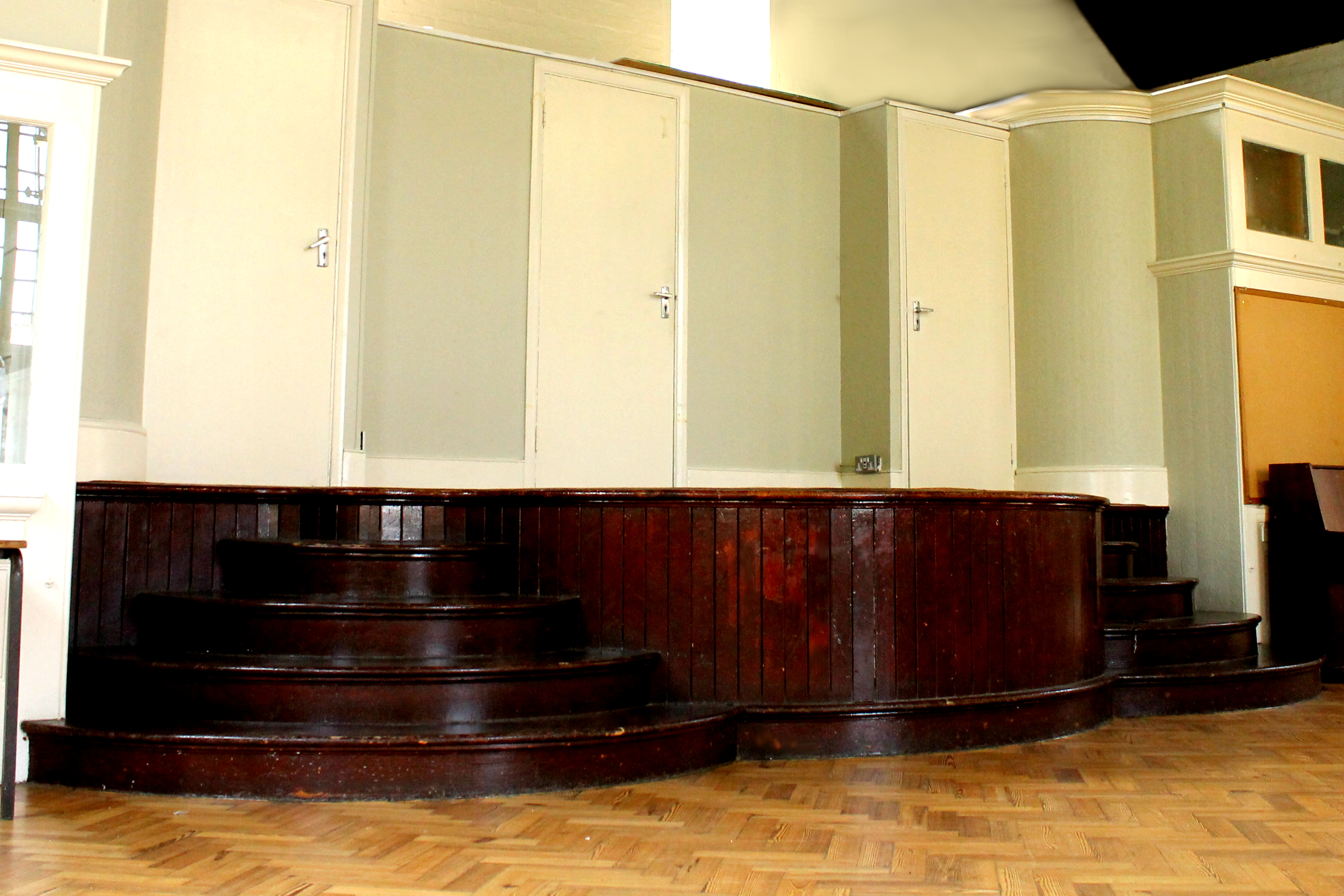 Versatile stage in Upper Hall, Hargrave Hall, ideal for presentations and performances.
