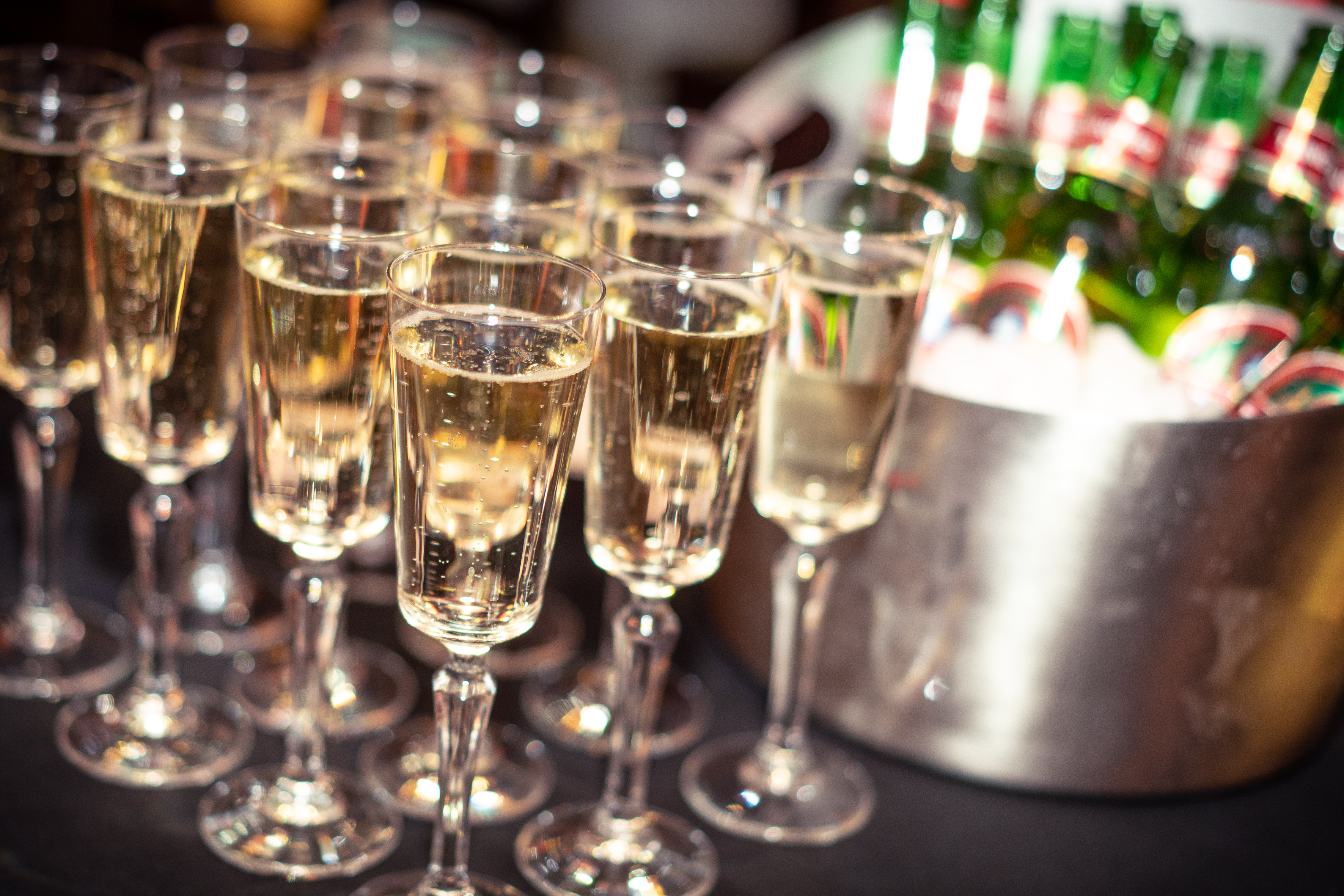 Elegant bar area with sparkling wine glasses for networking events and celebrations.