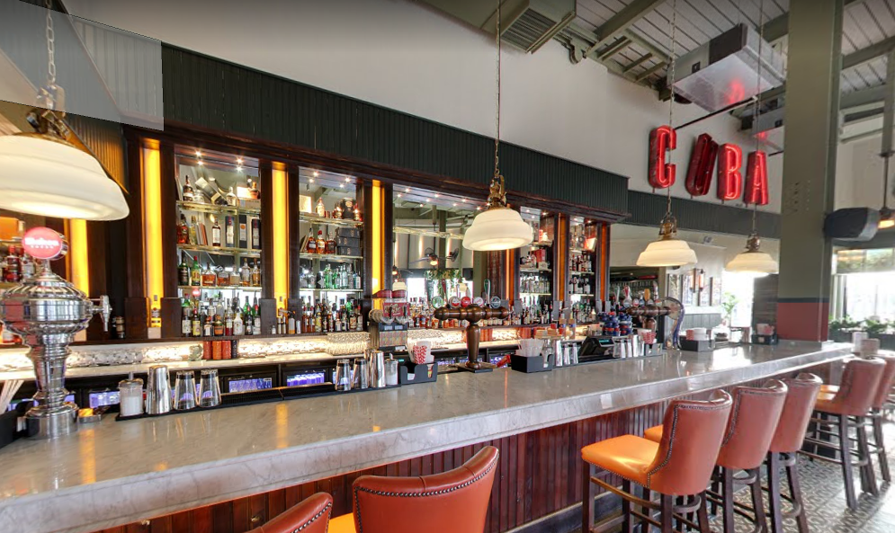 Stylish bar area at Revolucion De Cuba Milton Keynes for networking events and gatherings.