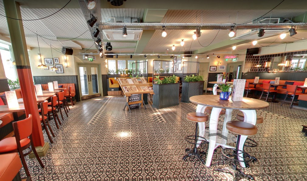 Versatile event space with decorative tile flooring at Revolucion De Cuba Milton Keynes.