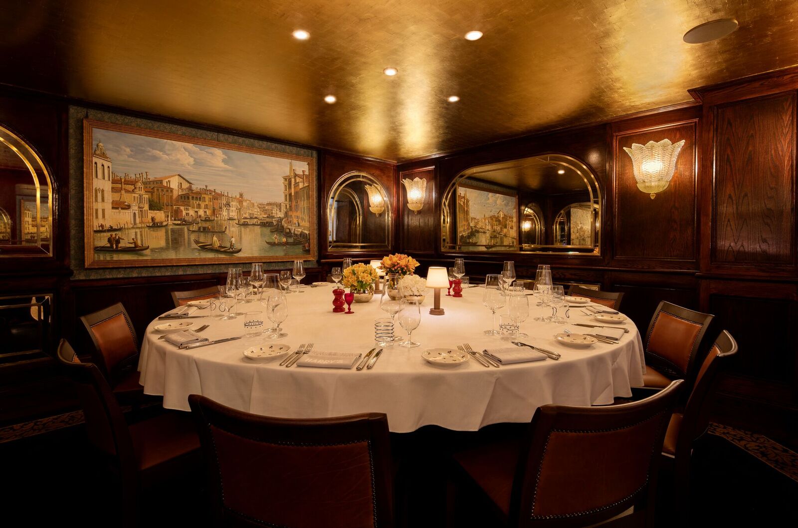 Elegant Canaletto Room with round table, ideal for corporate dinners and upscale events.