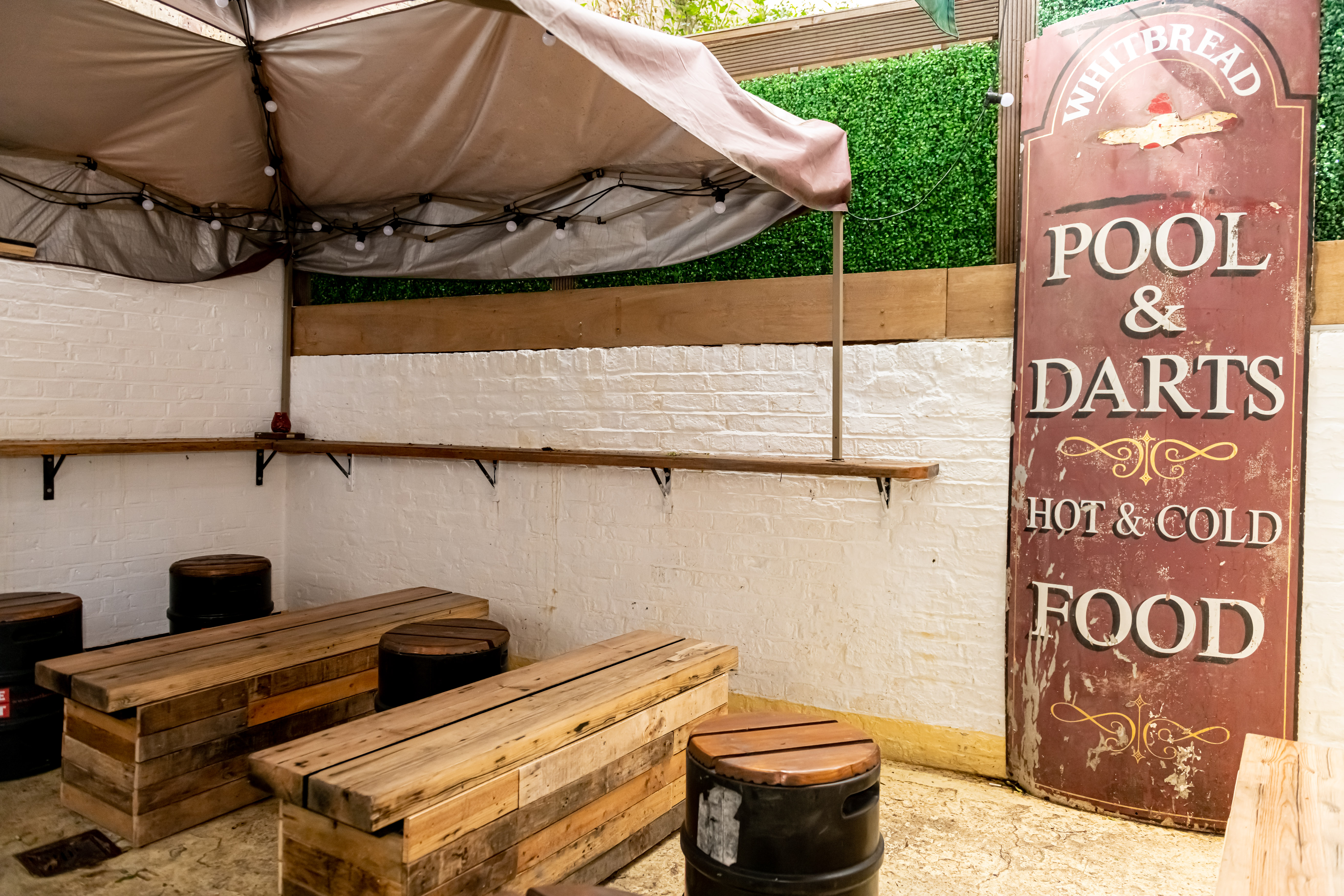 Cozy rustic event space with wooden seating for casual gatherings and networking.