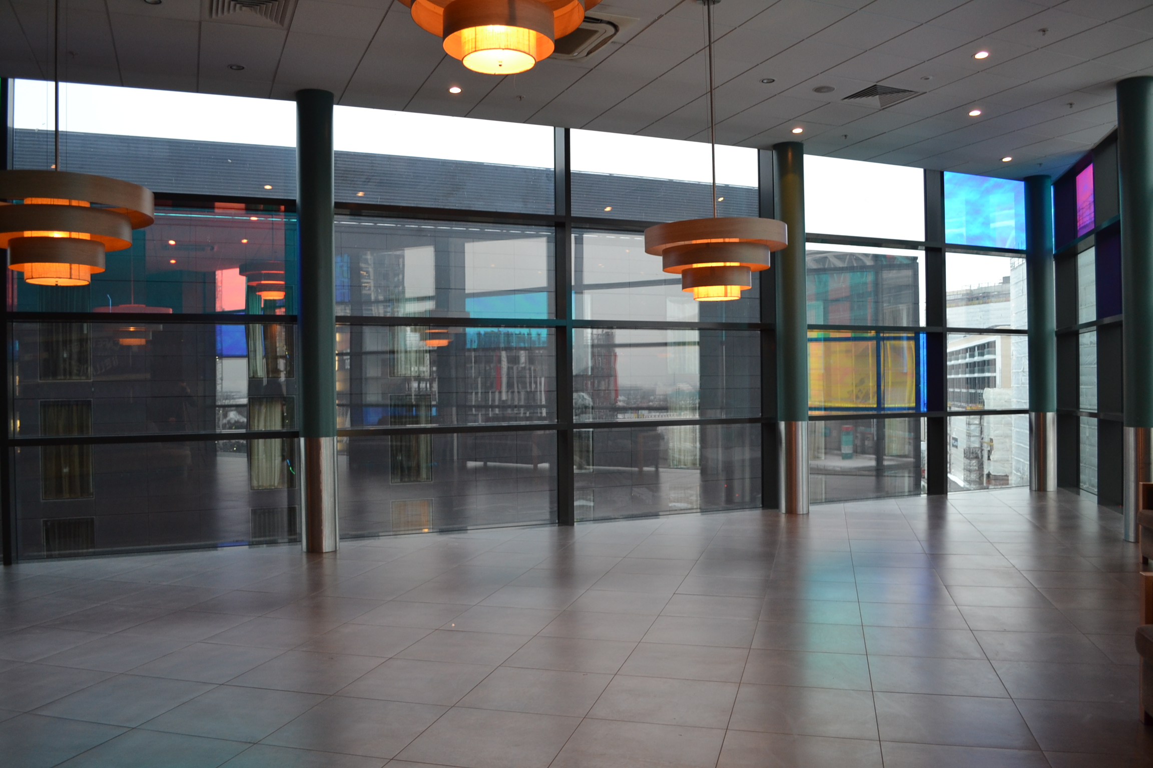 Spacious reception space with large windows at Cineworld Wembley for events and networking.