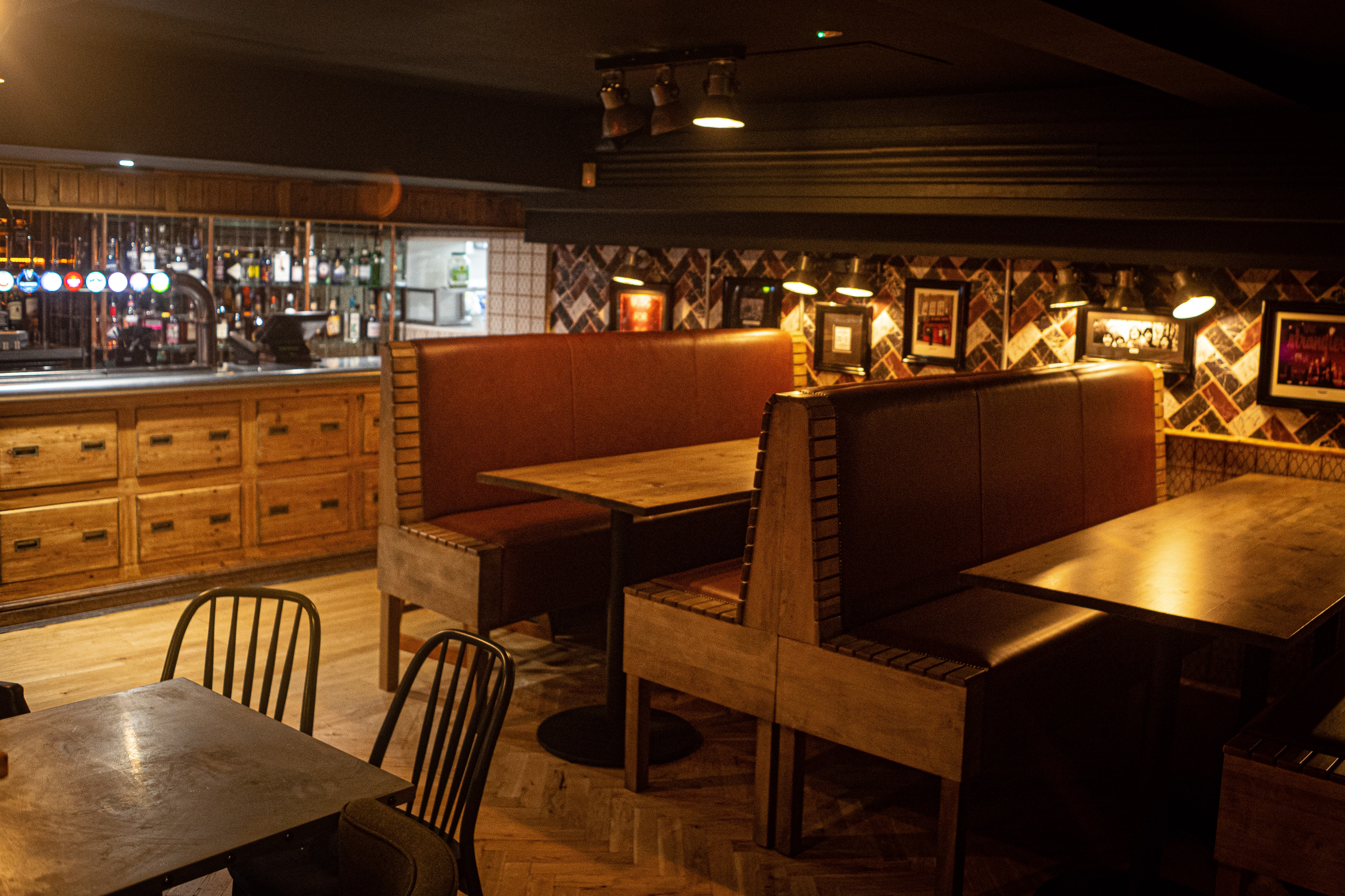 Cozy Backstage Basement venue with warm lighting for intimate meetings and events.