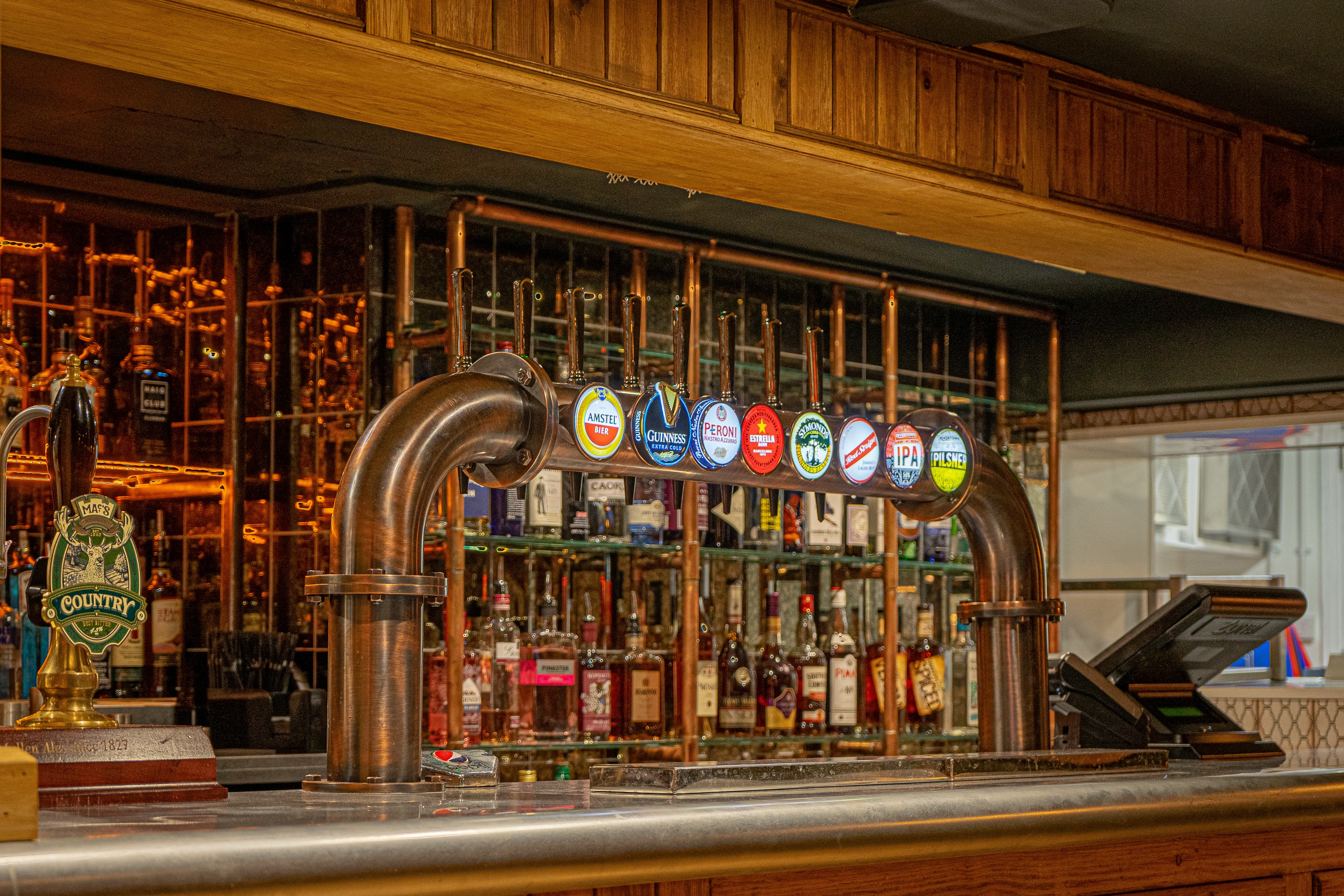 Backstage Basement bar with craft beer taps, ideal for networking events and gatherings.