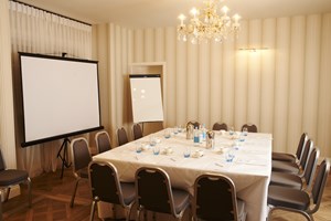 Harbour Suite meeting room with elegant chandelier for professional gatherings in Sidmouth.