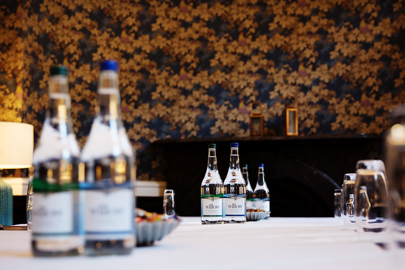 Elegant Blue Room meeting space with water bottles, ideal for corporate events in Bristol.