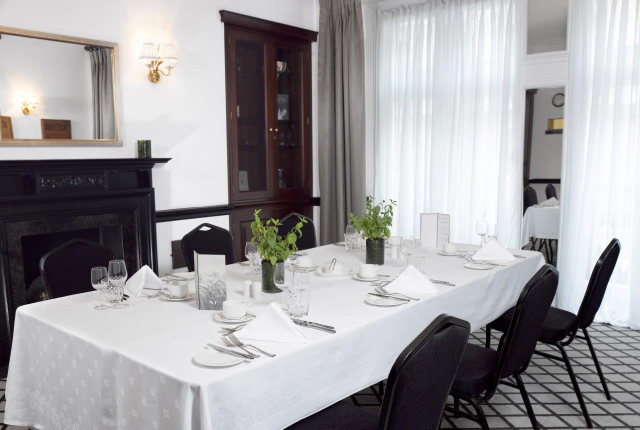 Elegant meeting space in The Farmers Club with natural light, ideal for upscale events.