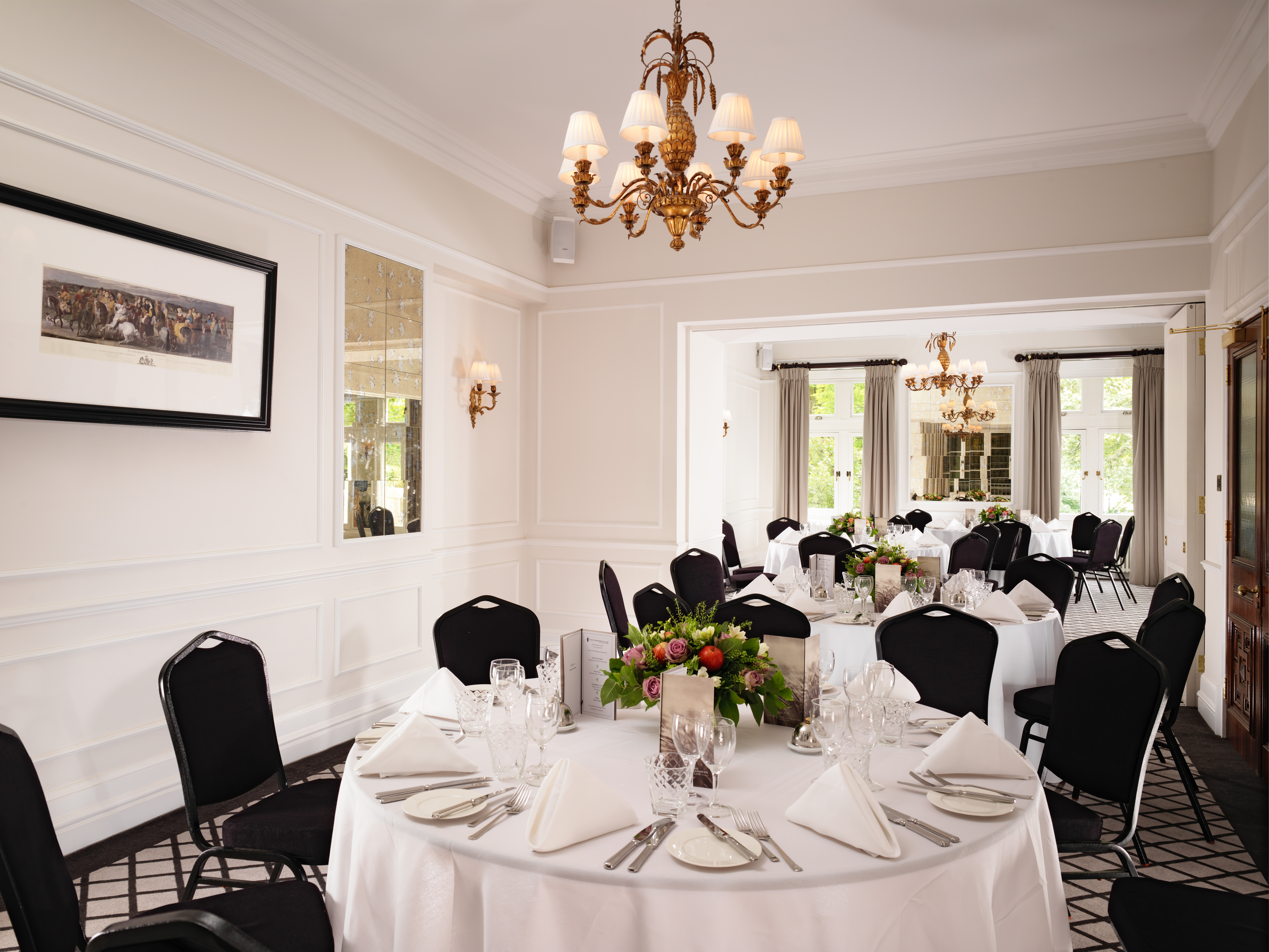 Elegant Hudson Room dining setup with floral centerpieces for upscale events.