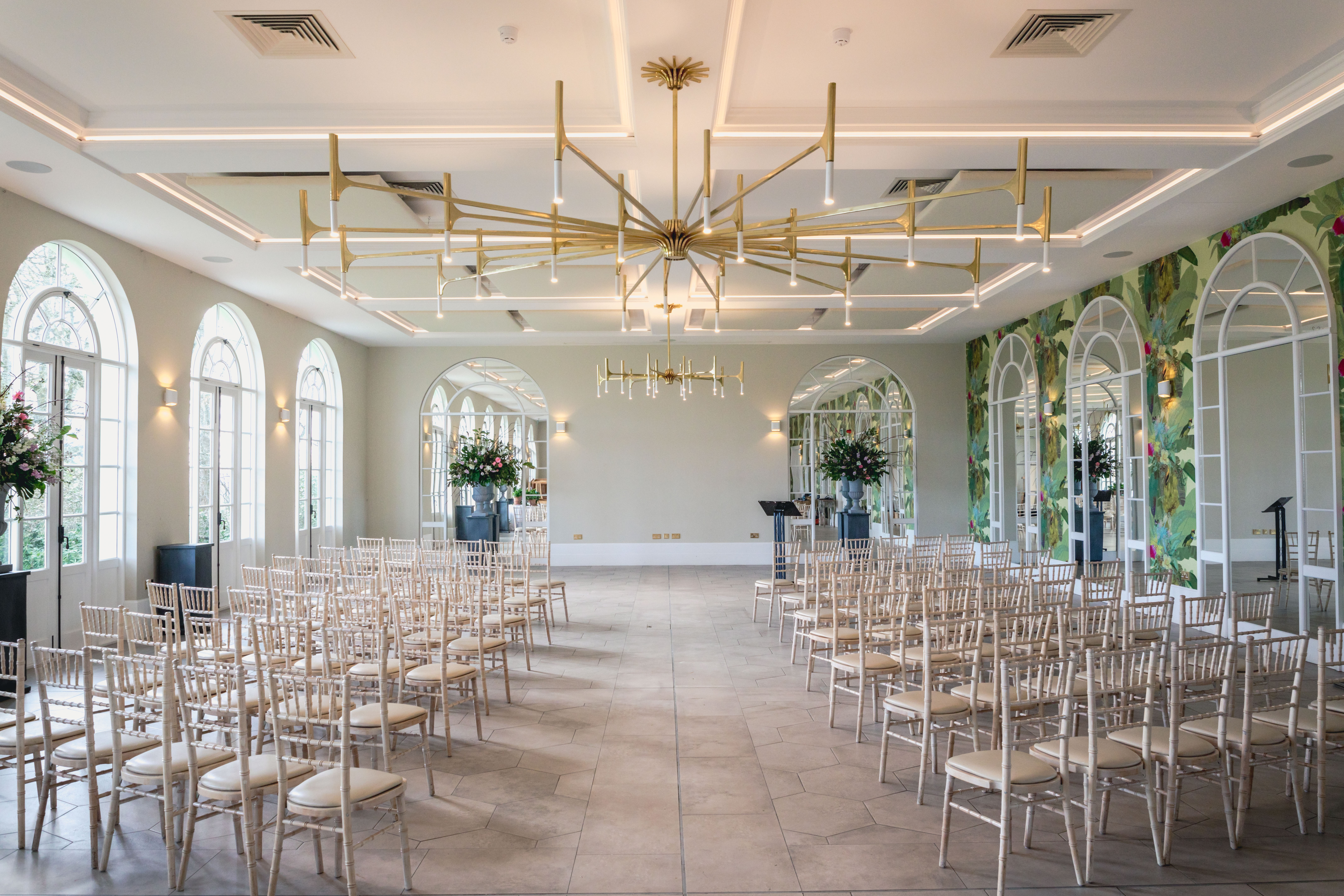 Elegant event space with chandeliers, perfect for weddings and corporate gatherings.