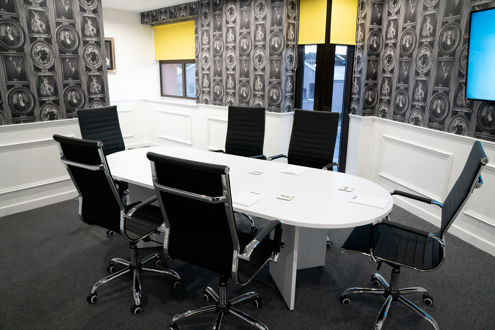 Modern conference room with oval table and ergonomic chairs in Foundry House, Widnes.