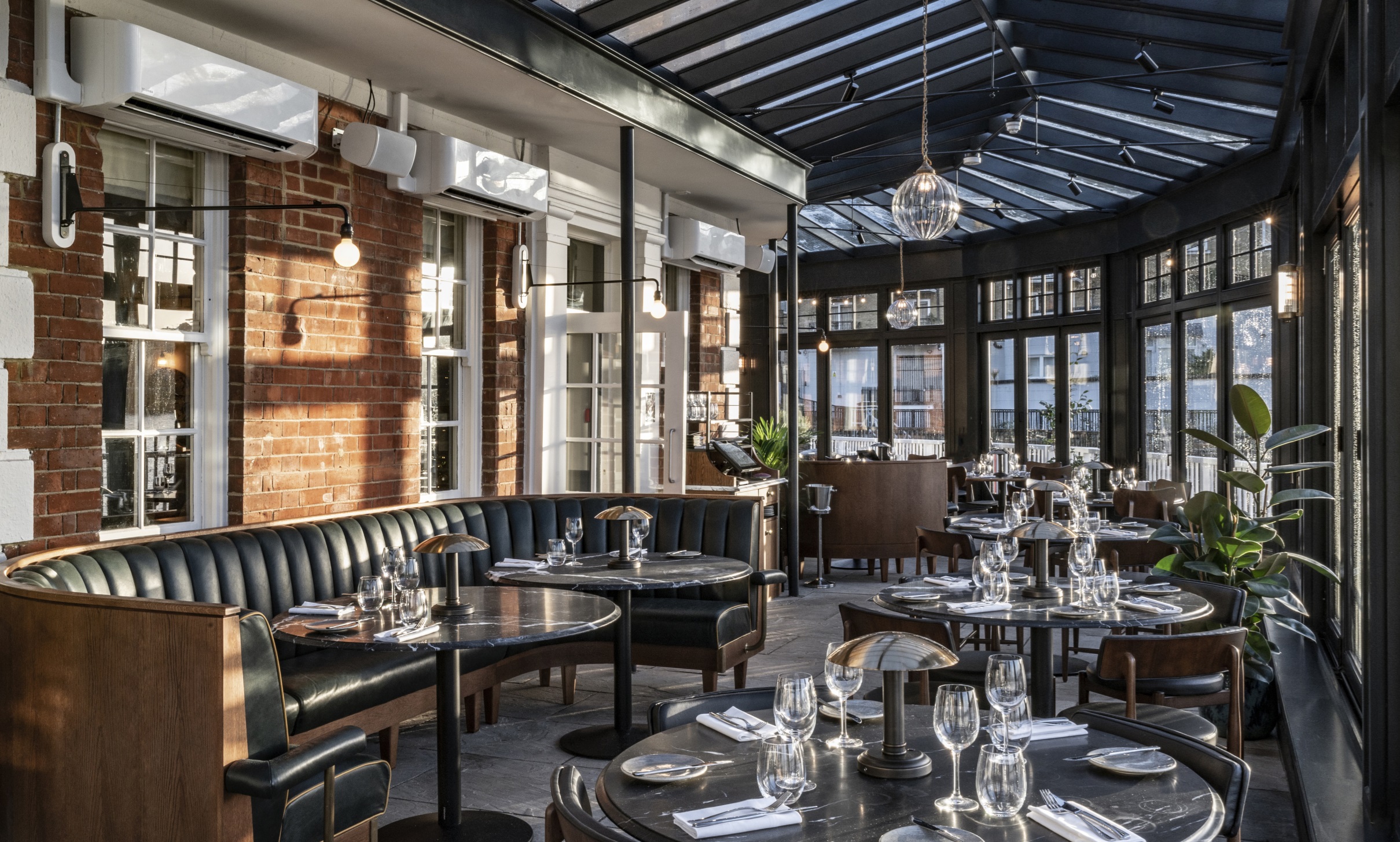 Stylish restaurant venue with large windows for corporate events and intimate gatherings.