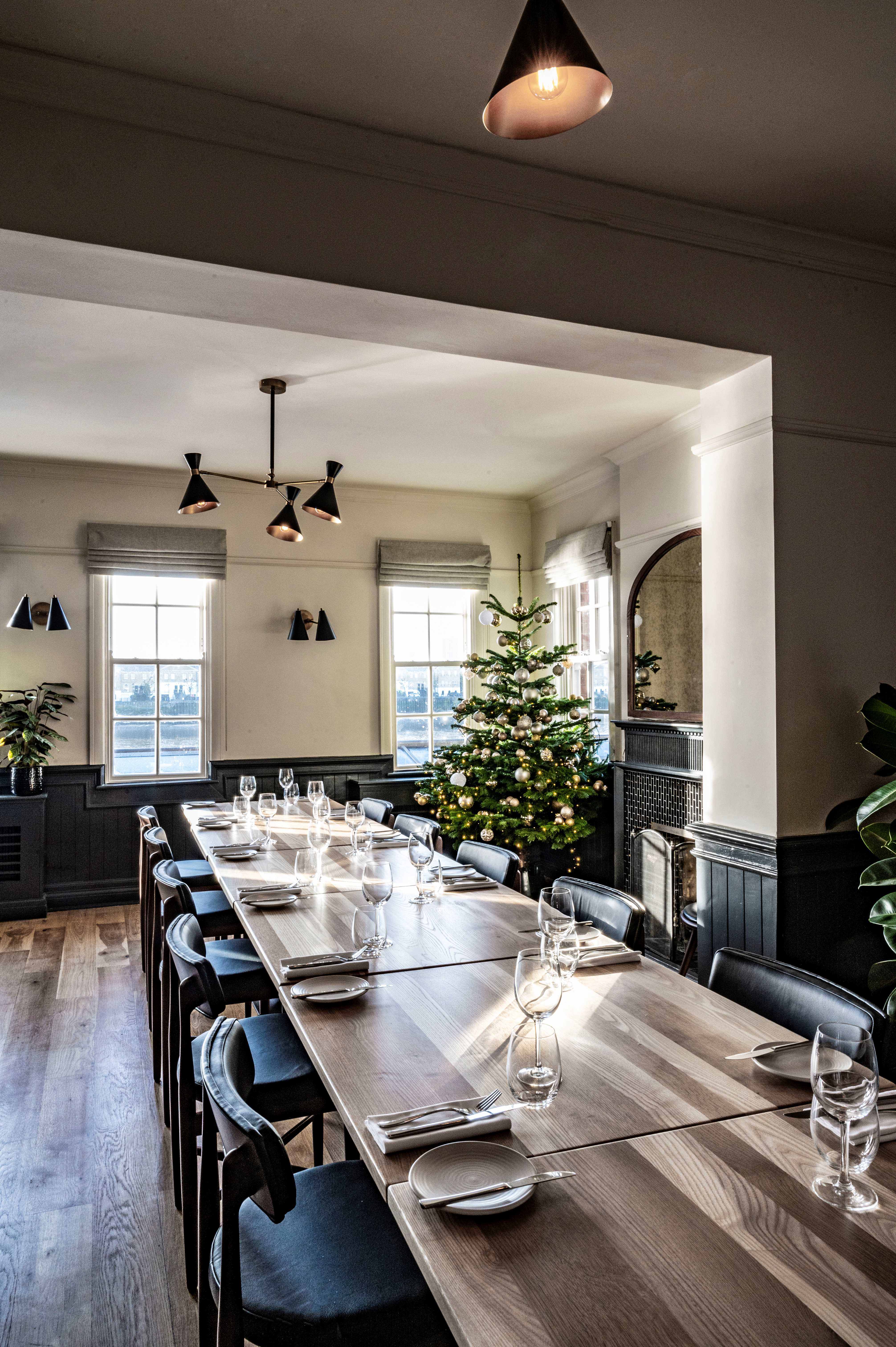 Elegant meeting space with long table, perfect for corporate retreats or holiday parties.