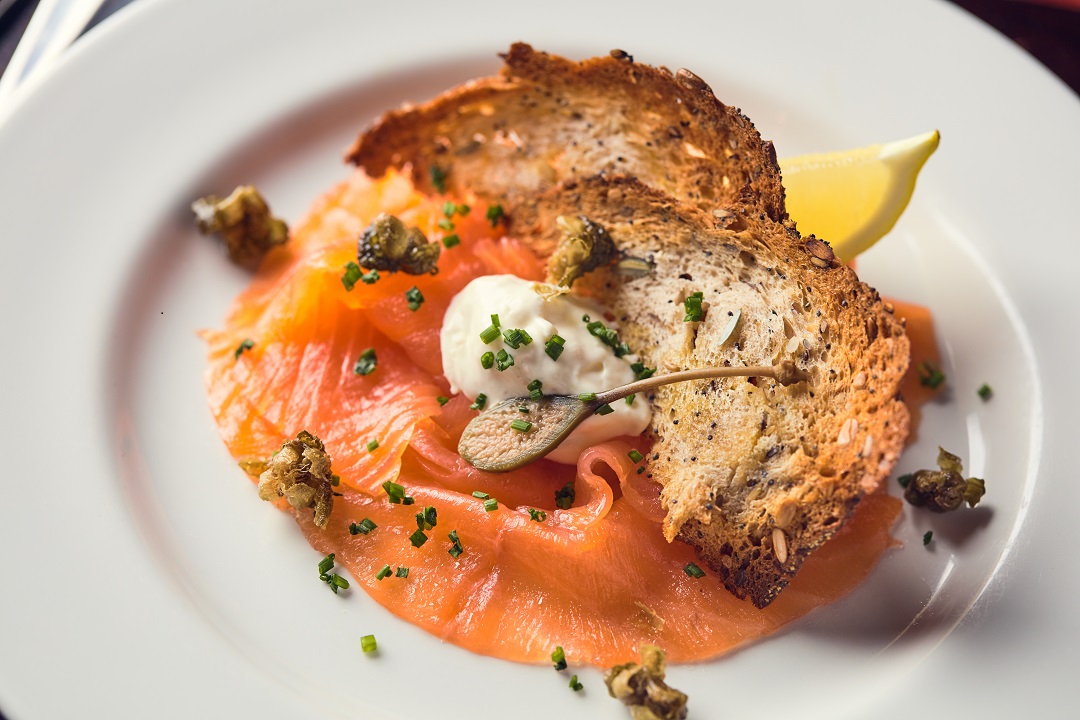 Smoked salmon dish in Crusting Pipe's Board Room, perfect for events and meetings.